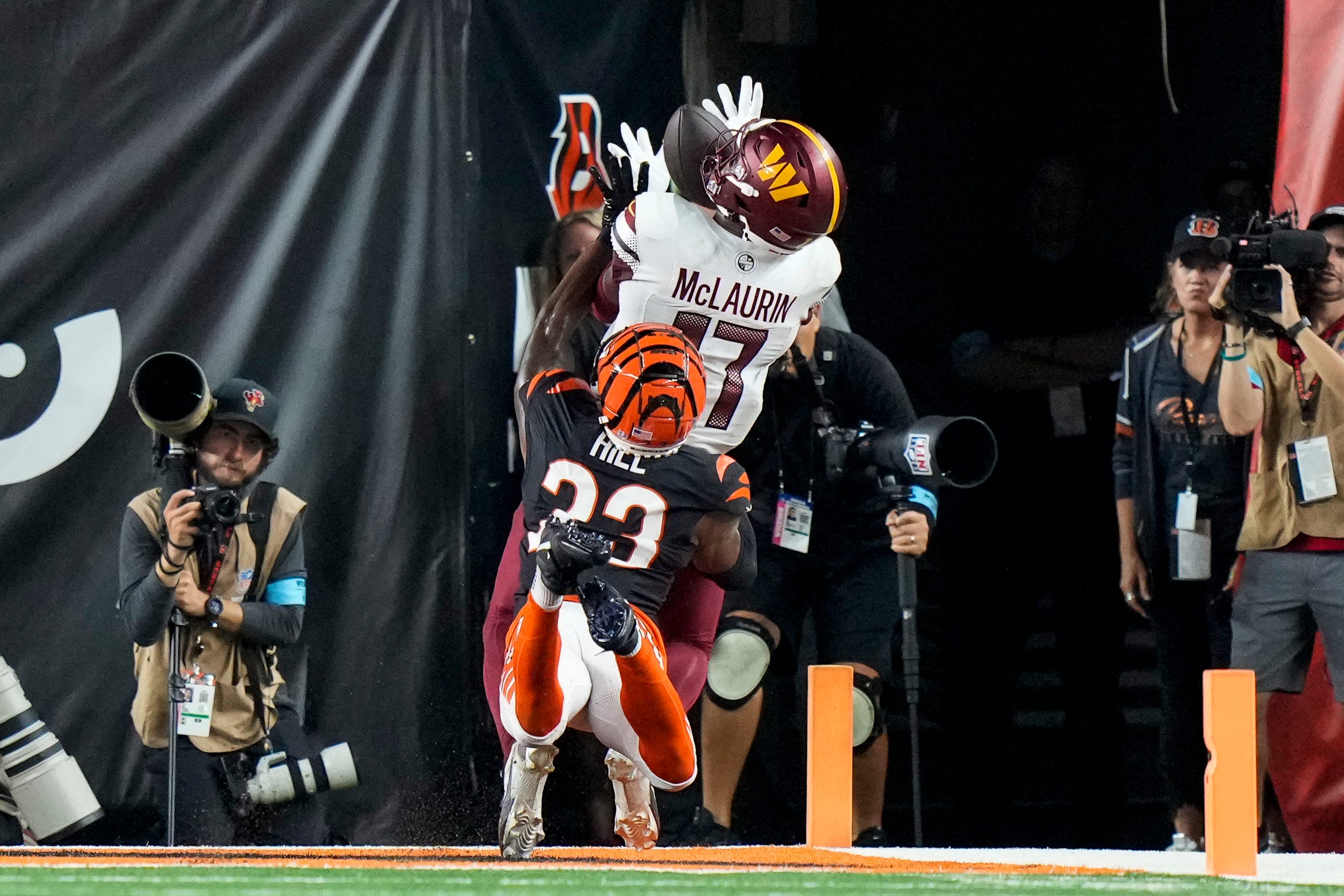 Washington Commanders wide receiver Terry McLaurin (17) catches a touchdown pass over Cincinnati Bengals cornerback Dax Hill (23) in the fourth quarter of the NFL Week 3 game between the Cincinnati Bengals and the Washington Commanders at Paycor Stadium in downtown Cincinnati on Monday, Sept. 23, 2024. The Bengals remain winless after a 38-33 loss to Washington.