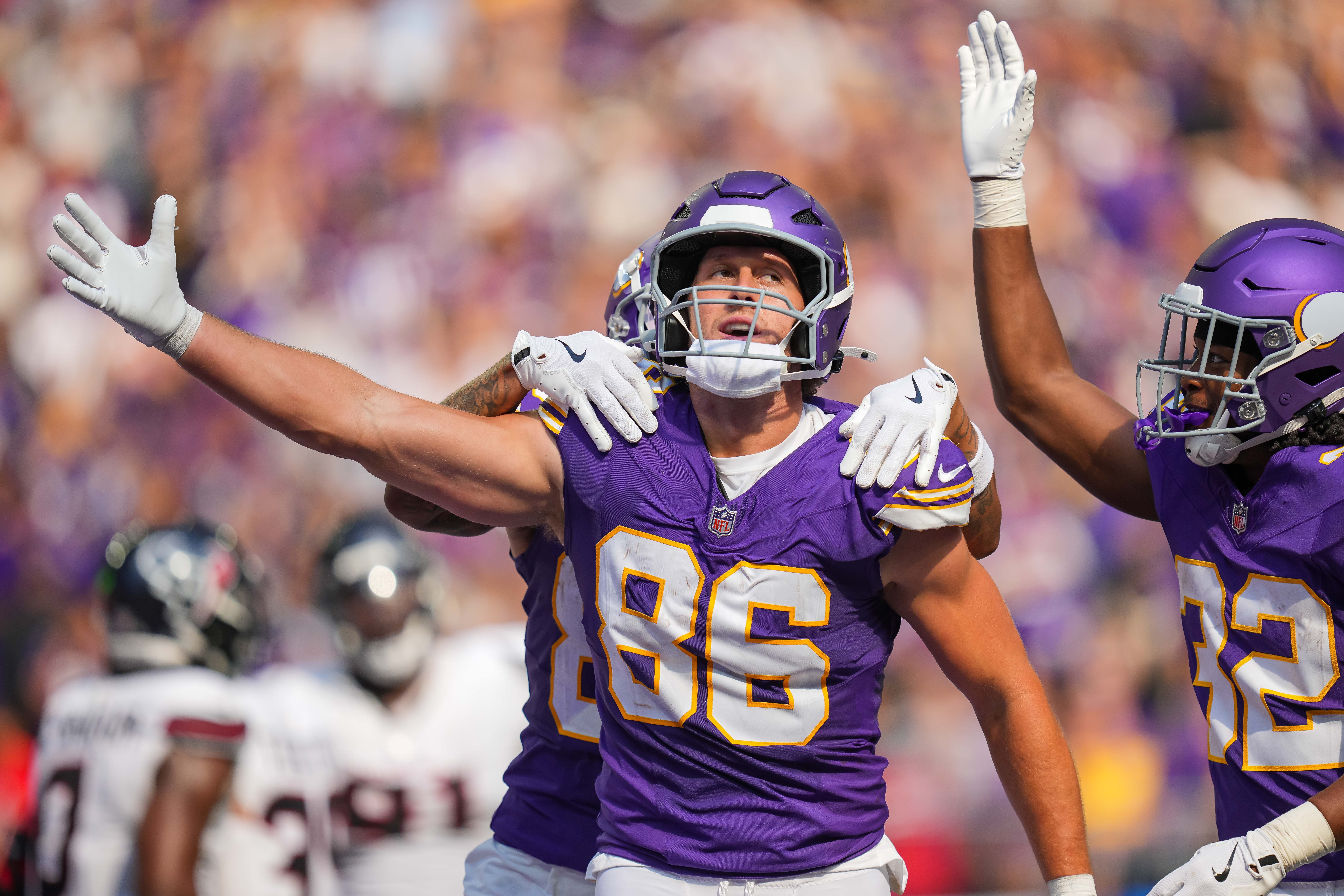 Sep 22, 2024; Minneapolis, Minnesota, USA; Minnesota Vikings tight end Johnny Mundt (86) celebrates his touchdown against the Houston Texans in the fourth quarter at U.S. Bank Stadium.