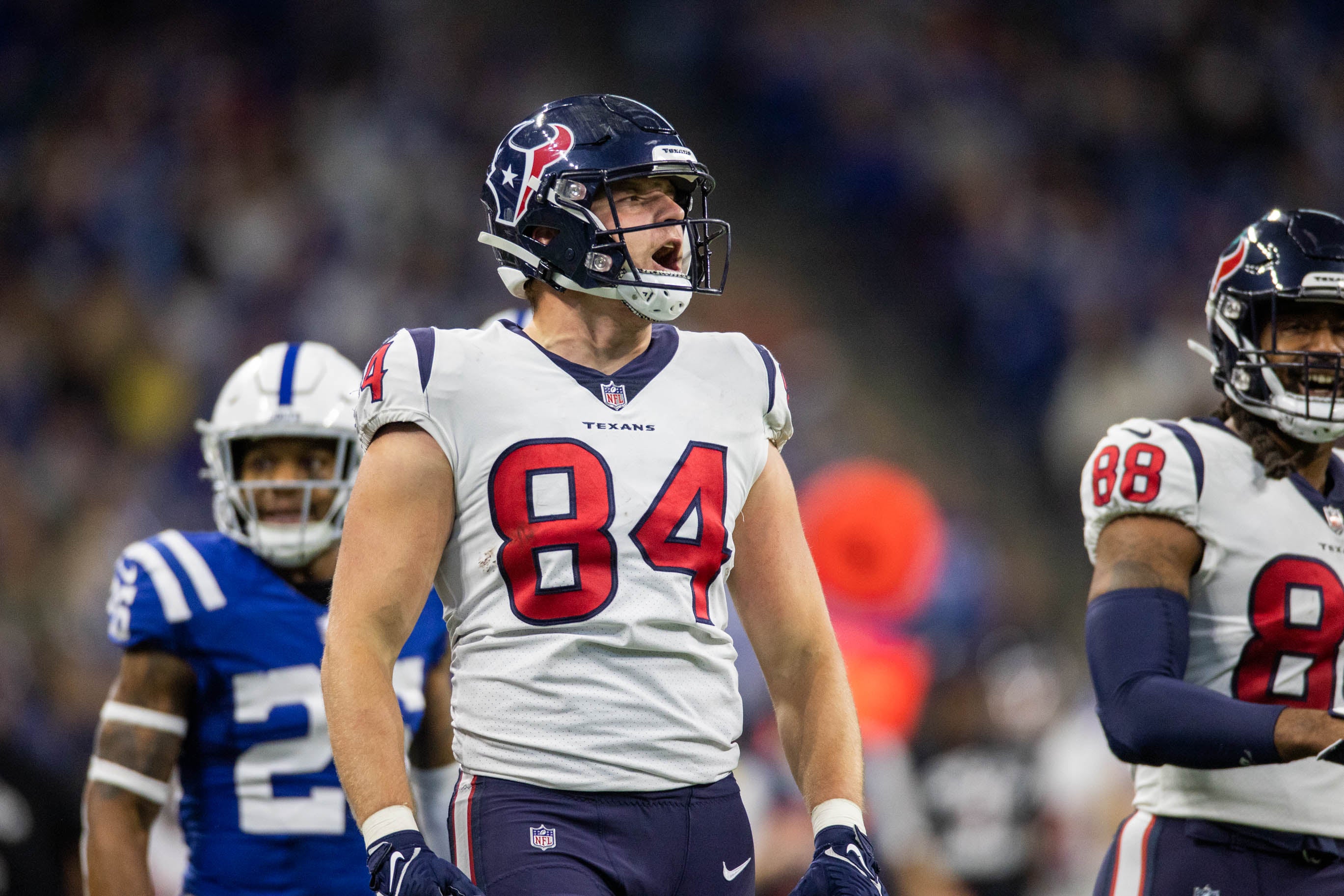 Jan 8, 2023; Indianapolis, Indiana, USA; Houston Texans tight end Teagan Quitoriano (84) celebrates a first down in the third quarter against the Indianapolis Colts at Lucas Oil Stadium.