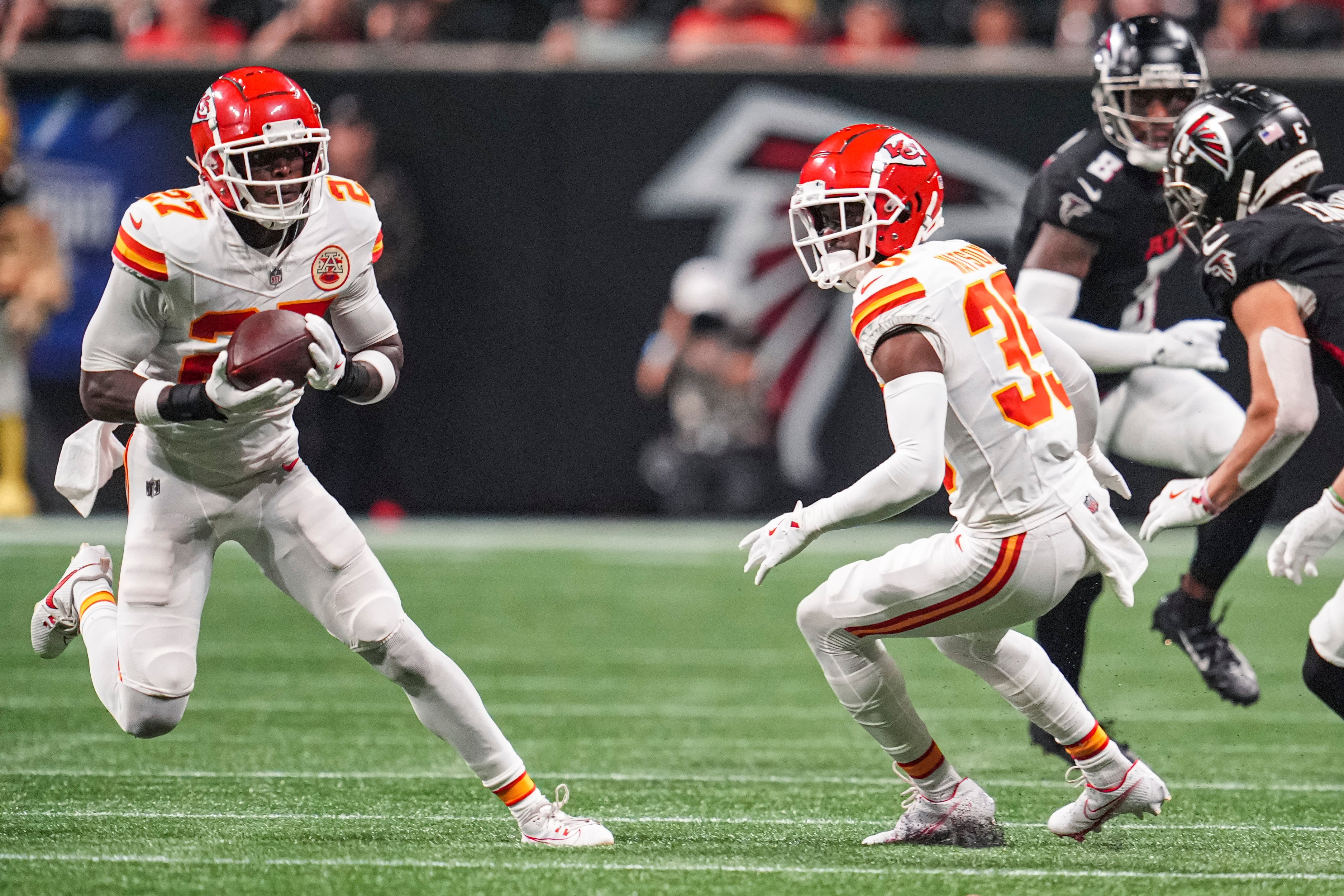 Chiefs safety Chamarri Conner (27) intercepts a pass against the Atlanta Falcons.