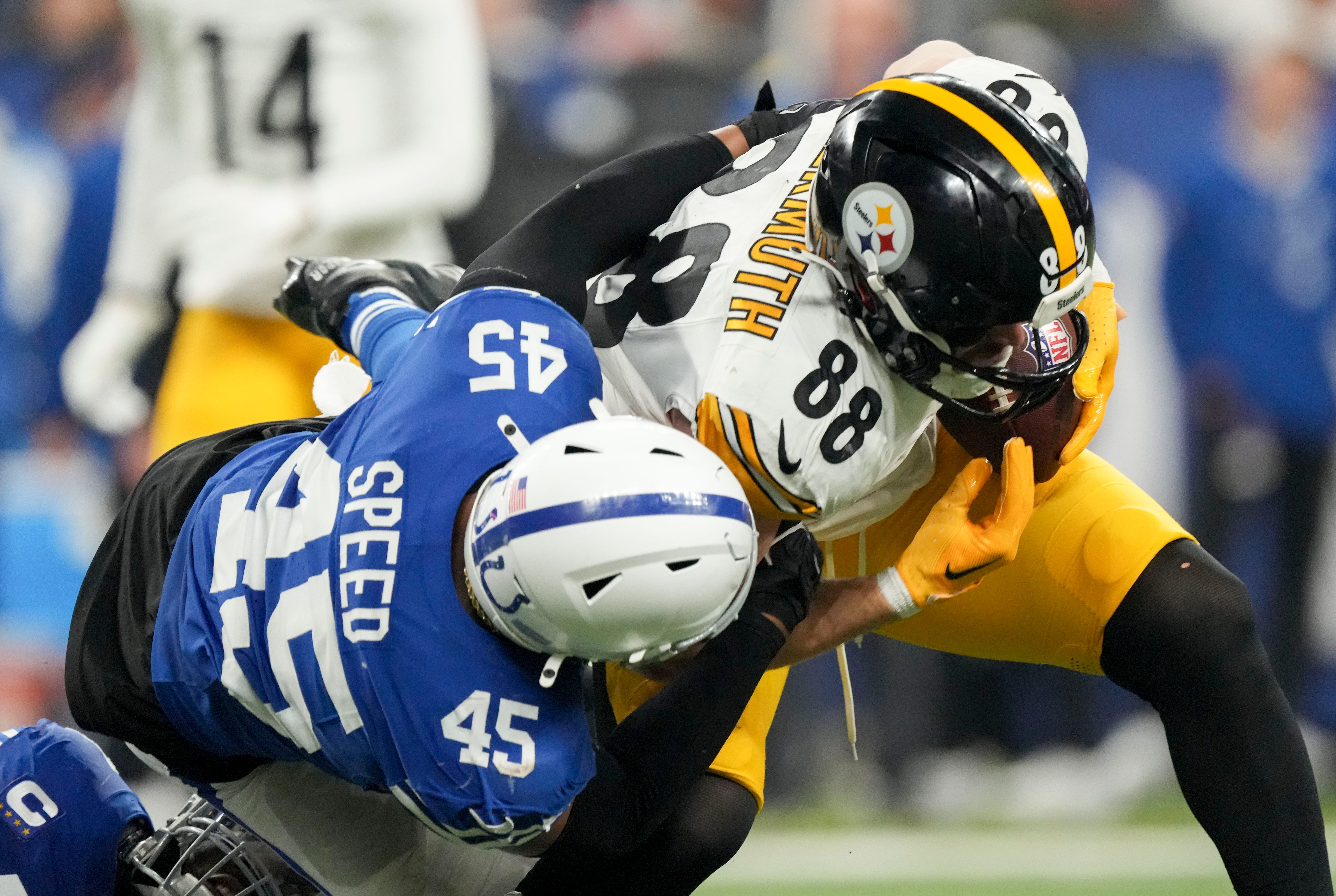 Indianapolis Colts linebacker E.J. Speed (45) brings down Pittsburgh Steelers tight end Pat Freiermuth (88) on Saturday, Dec. 16, 2023, during a game against the Pittsburgh Steelers at Lucas Oil Stadium in Indianapolis.