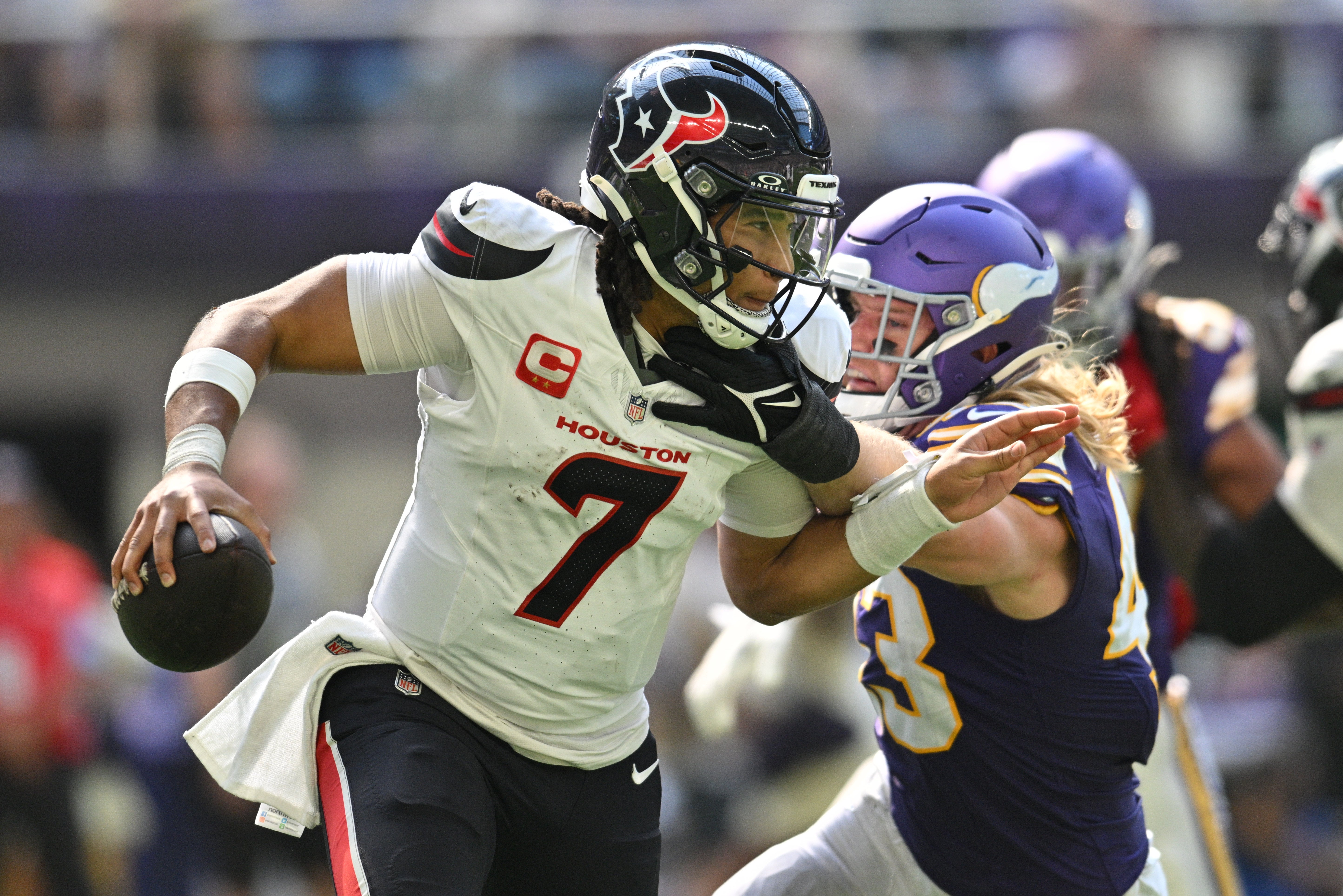 Sep 22, 2024; Minneapolis, Minnesota, USA; Houston Texans quarterback C.J. Stroud (7) is sacked by Minnesota Vikings linebacker Andrew Van Ginkel (43) during the second quarter at U.S. Bank Stadium.