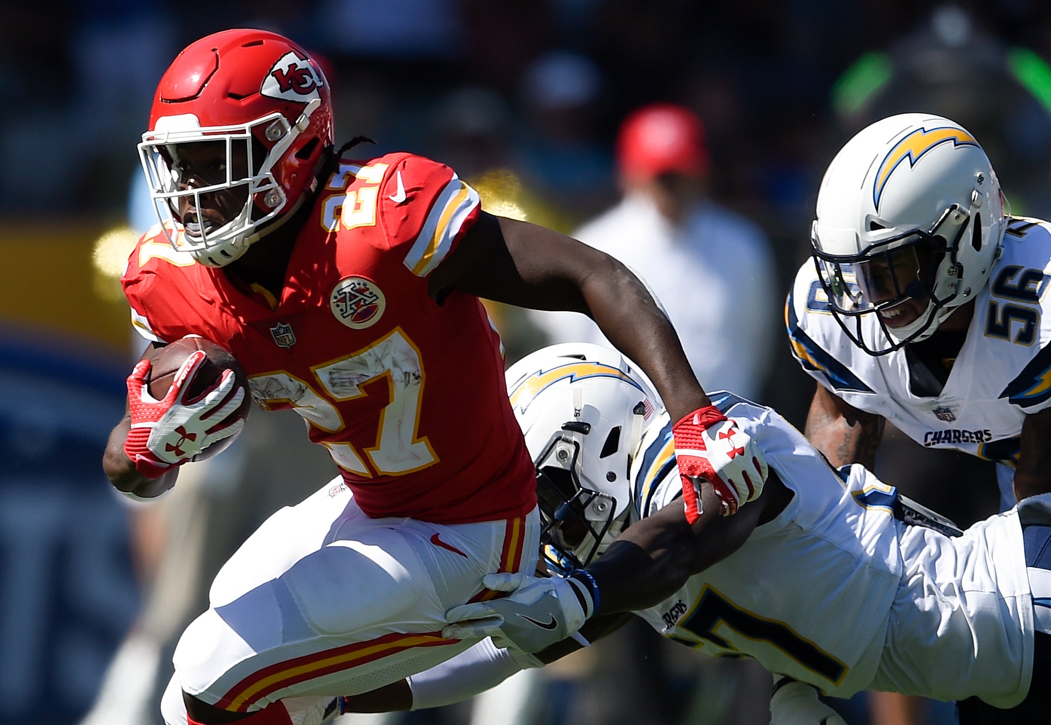 Sep 24, 2017; Carson, CA, USA; Kansas City Chiefs running back Kareem Hunt (27) runs the ball ahead of Los Angles Chargers inside linebacker Jatavis Brown (57) during the second quarter at StubHub Center.