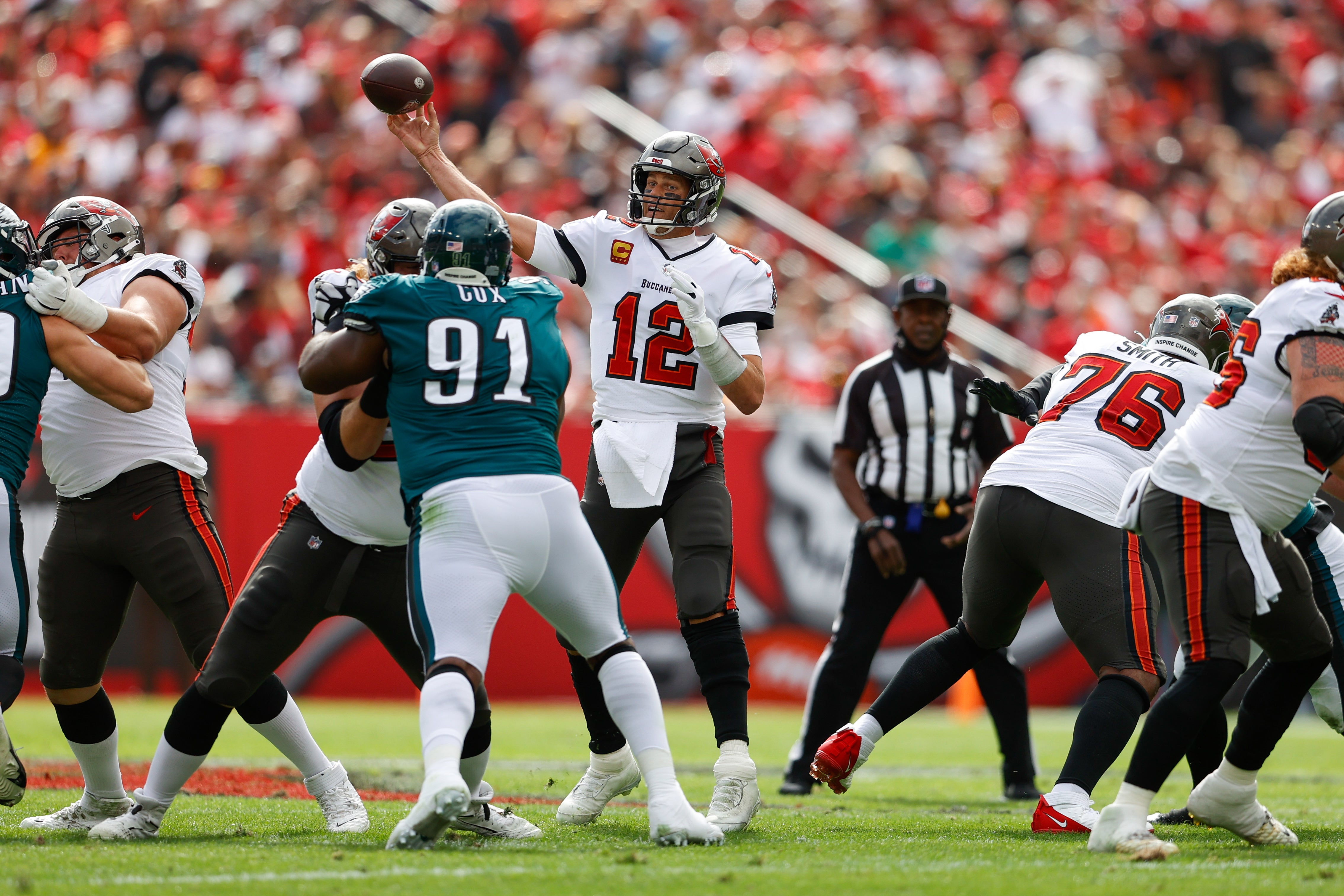 Jan 16, 2022; Tampa, Florida, USA; Tampa Bay Buccaneers quarterback Tom Brady (12) trows a pass in the first half against the Philadelphia Eagles in a NFC Wild Card playoff football game at Raymond James Stadium.