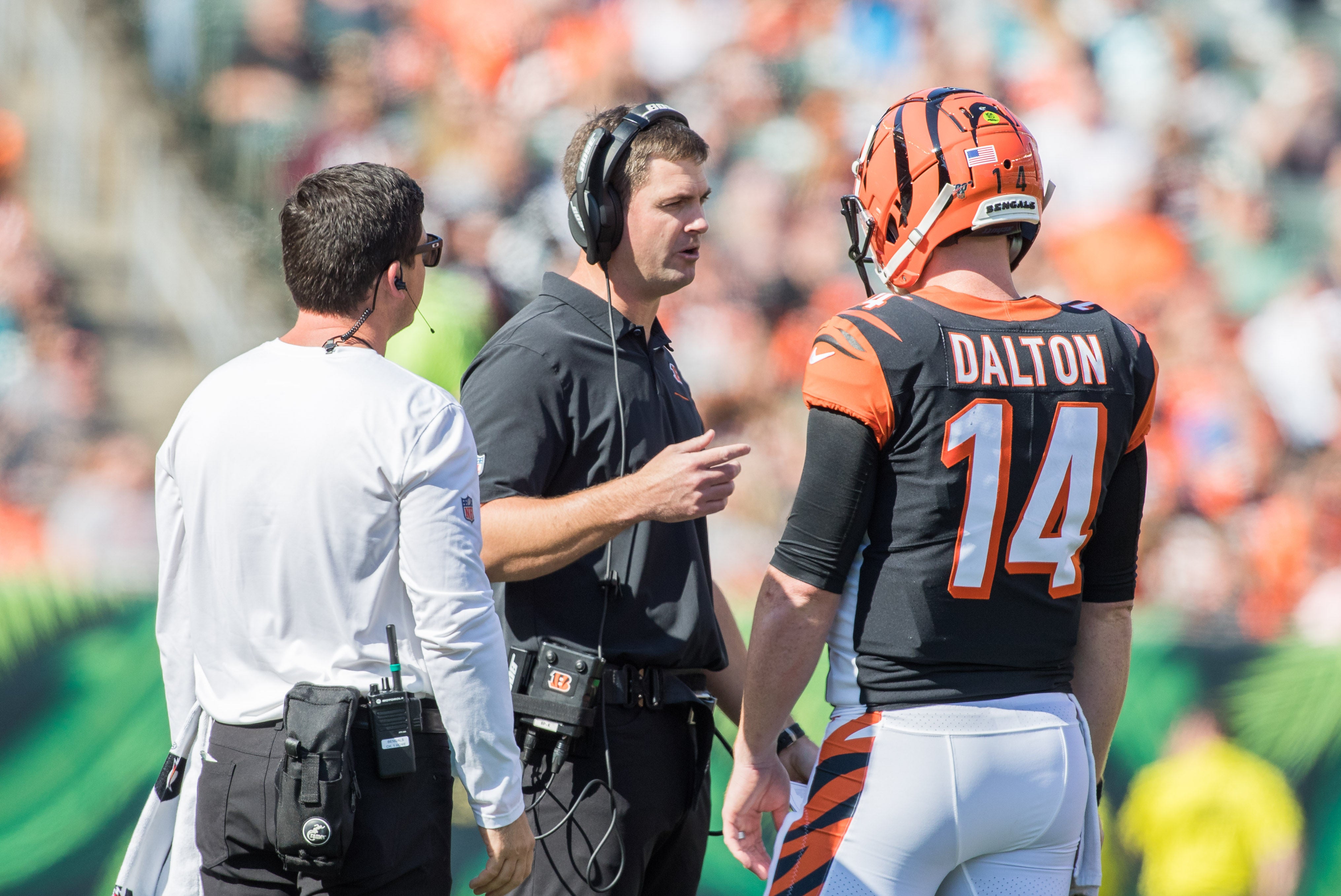 Oct 20, 2019; Cincinnati, OH, USA; Cincinnati Bengals head coach Zac Taylor talks with quarterback Andy Dalton (14) during a timeout in the second quarter against the Jacksonville Jaguars at Paul Brown Stadium.