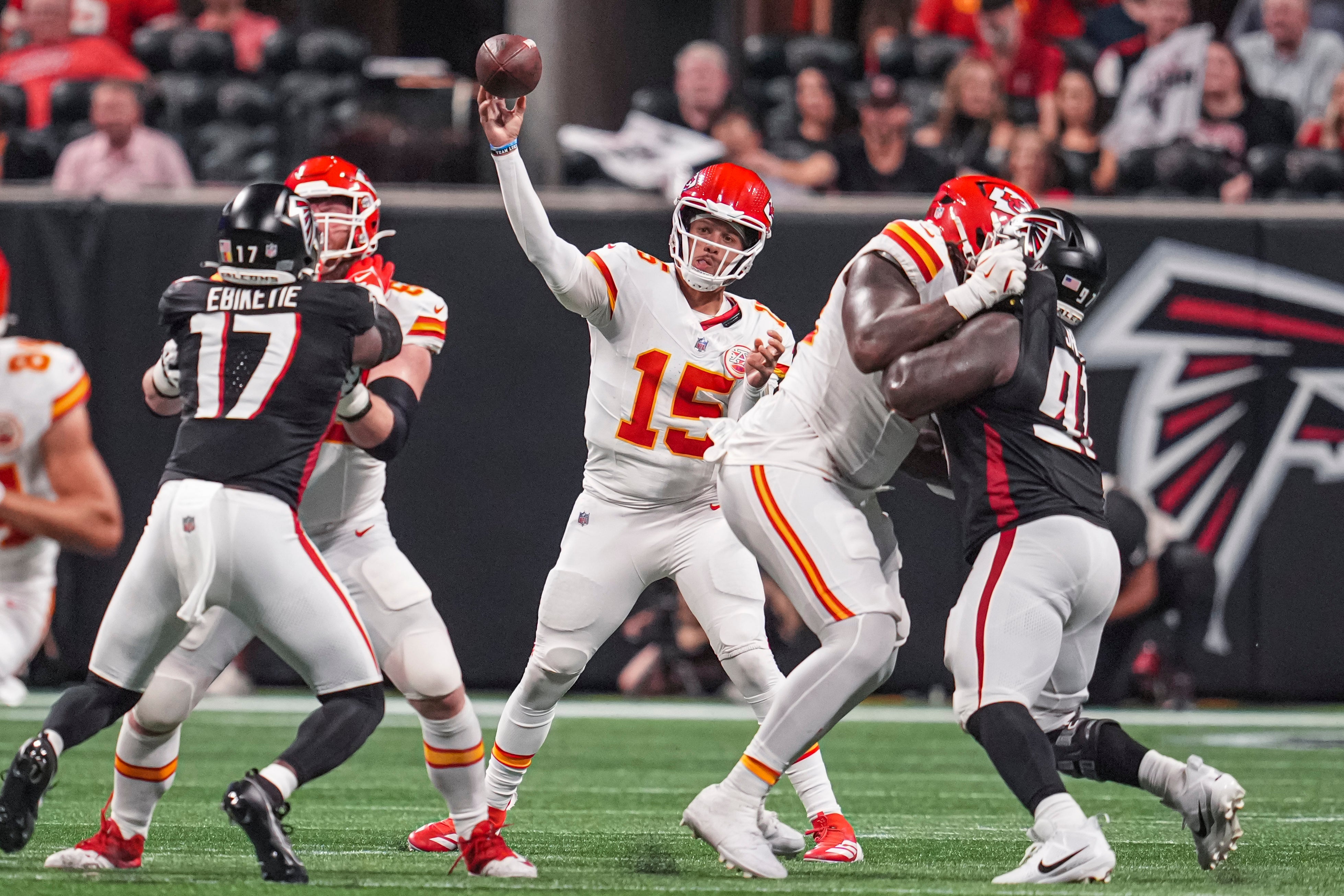 Sep 22, 2024; Atlanta, Georgia, USA; Kansas City Chiefs quarterback Patrick Mahomes (15) passes the ball against the Atlanta Falcons during the first half at Mercedes-Benz Stadium.