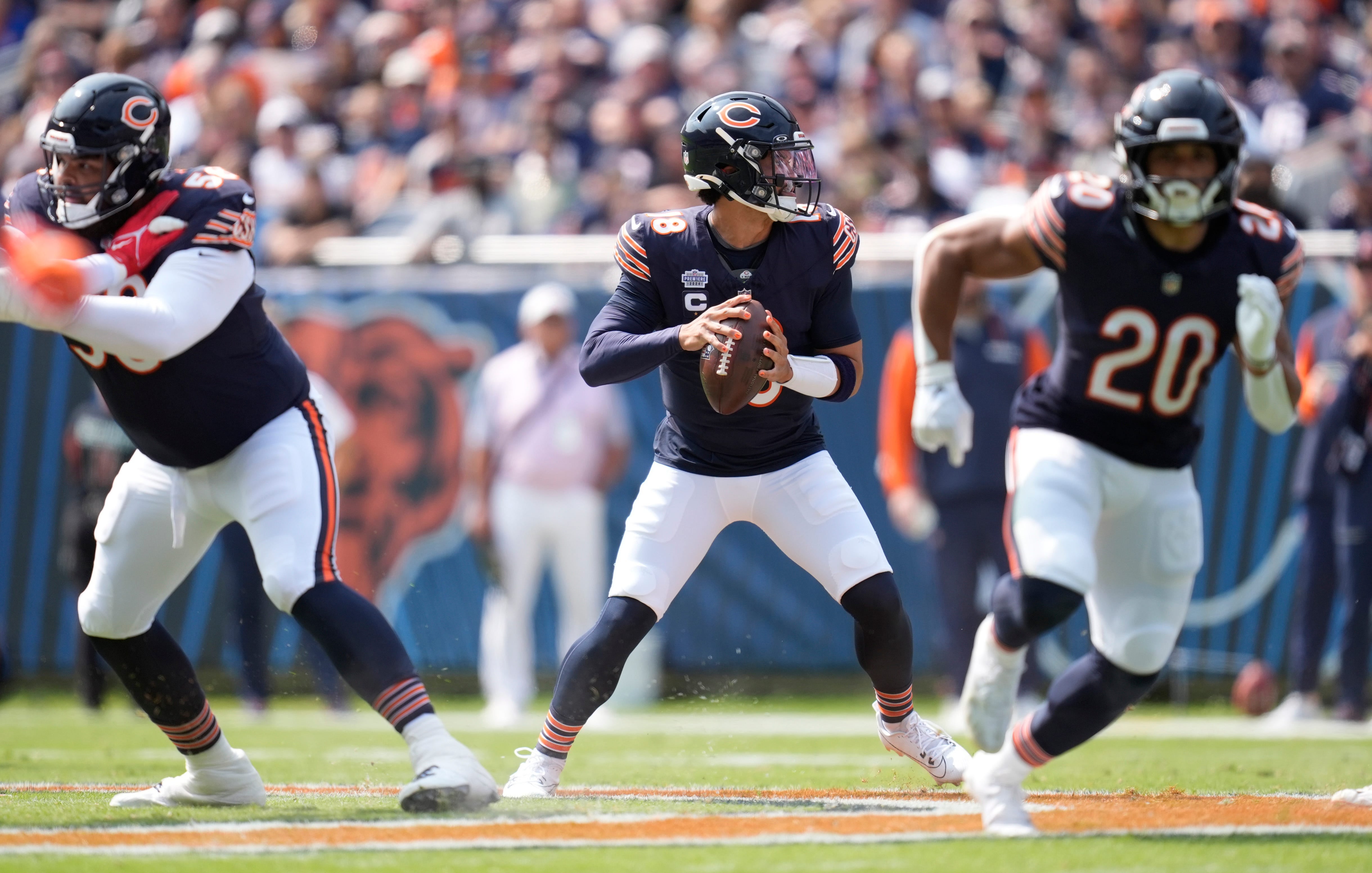 Chicago Bears quarterback Caleb Williams (18) drops back to pass against the Tennessee Titans in the first quarter of their game at Soldier Field in Chicago, Ill., Sunday, Sept. 8, 2024.