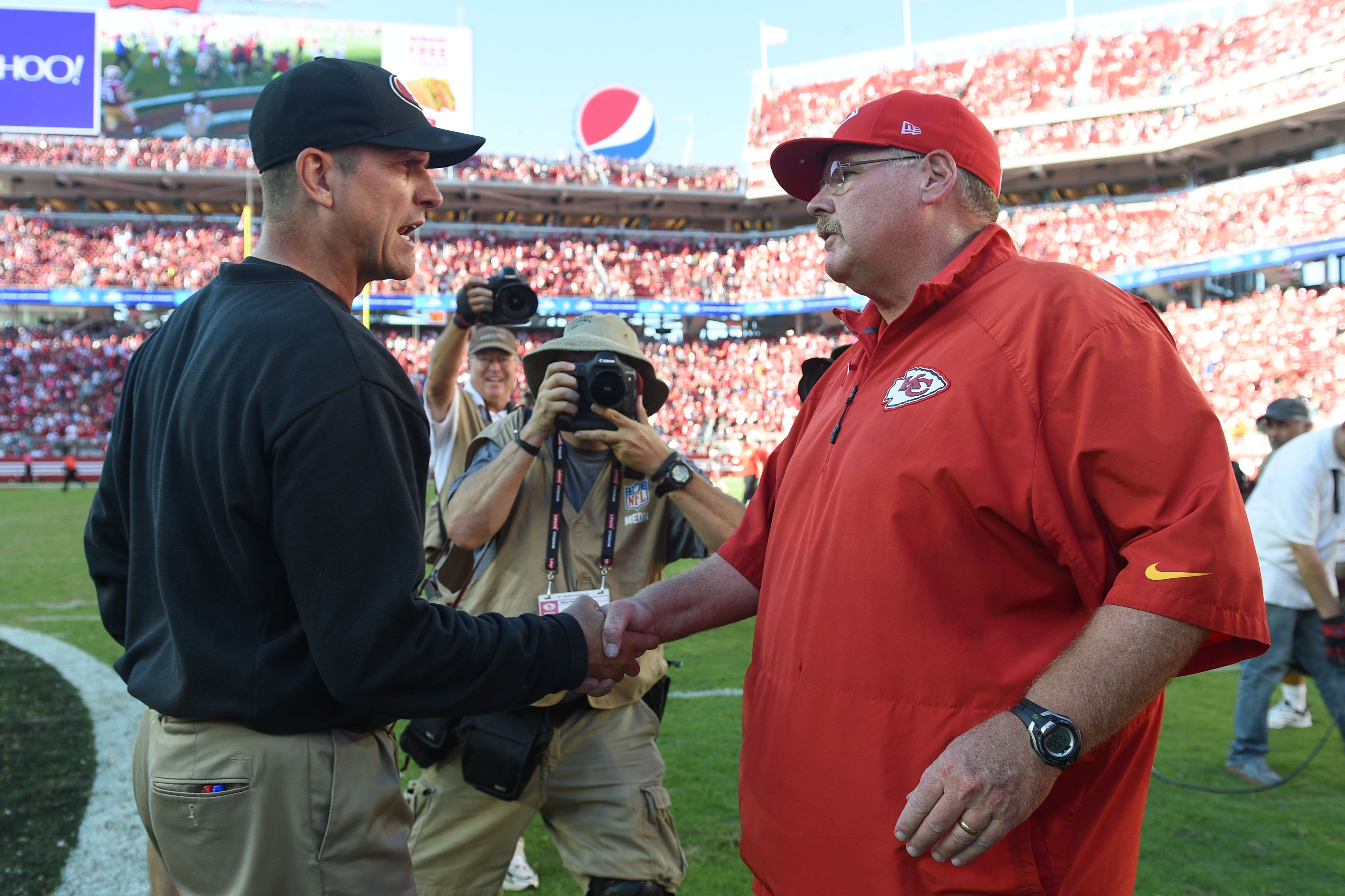 Jim Harbaugh shakes hands with Andy Reid