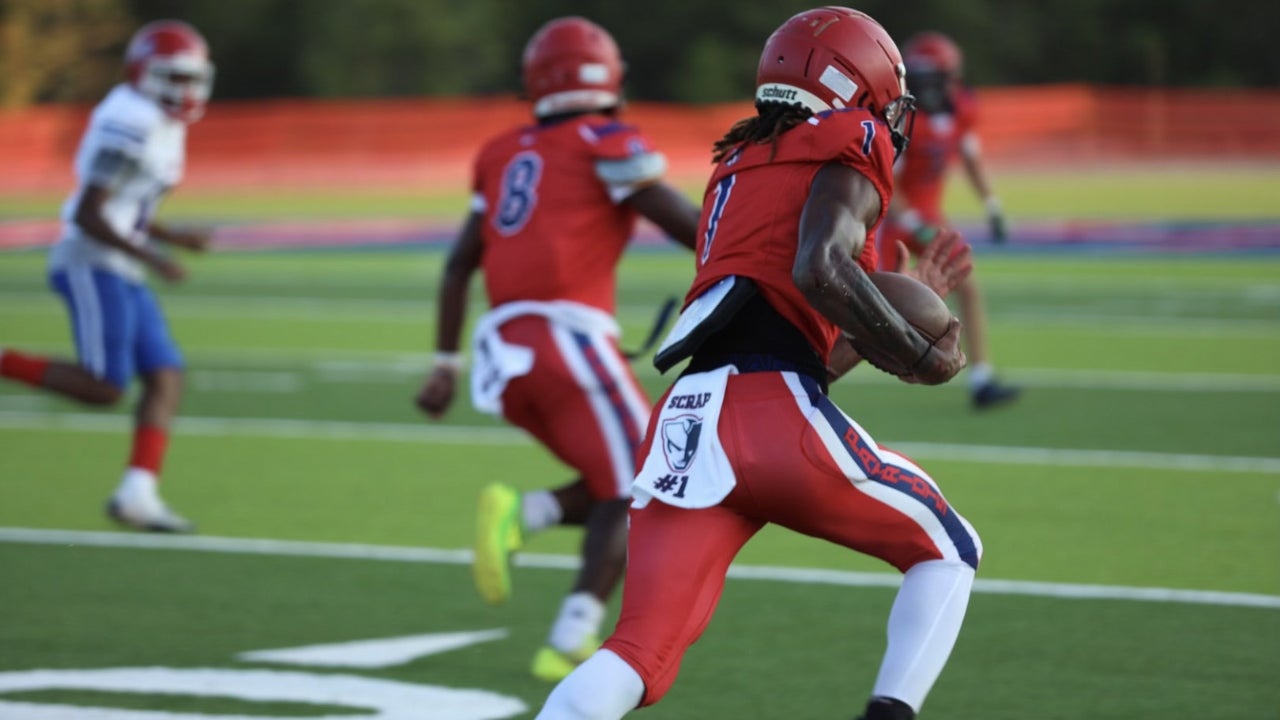 Antavious Richardson carries the football