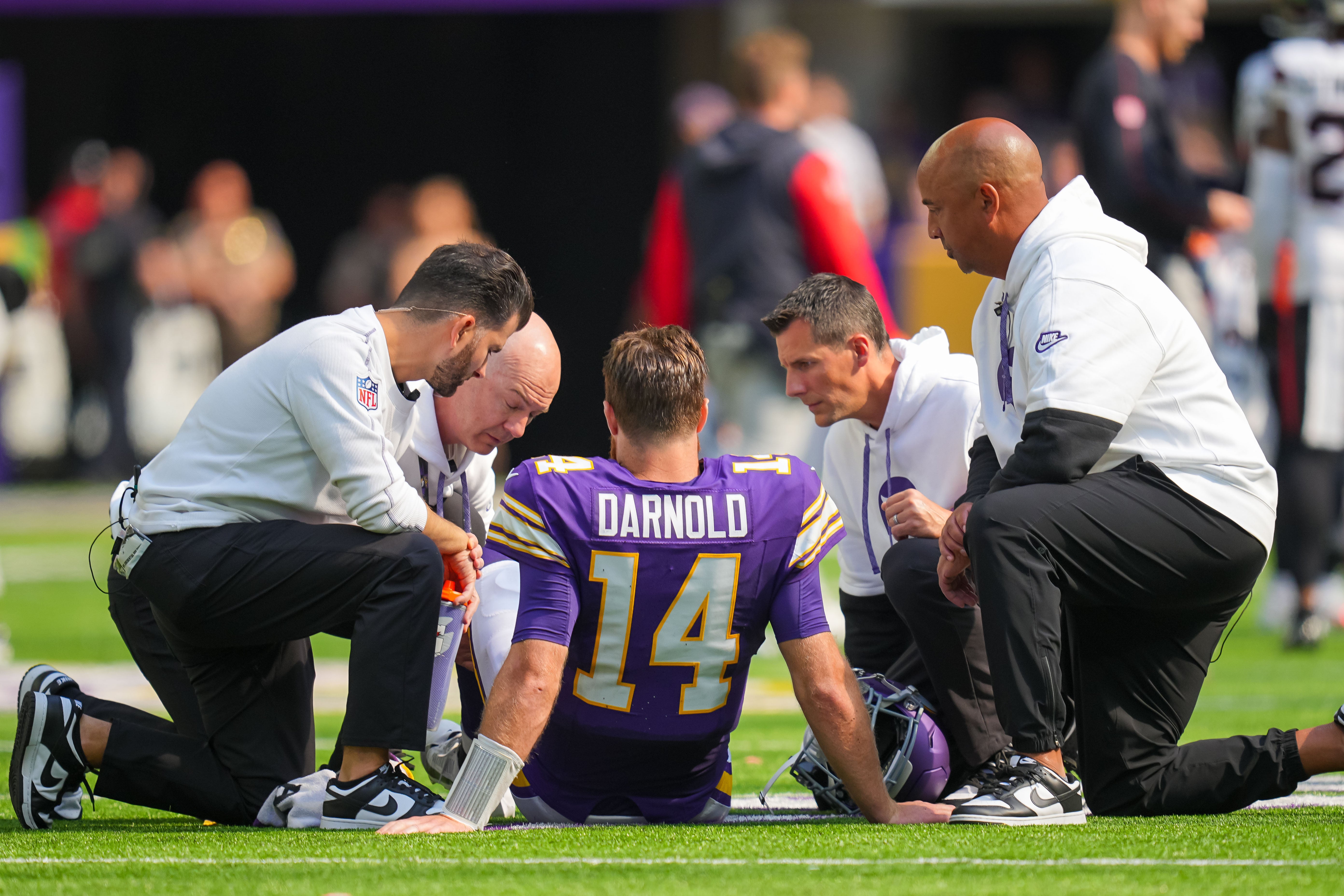 Sep 22, 2024; Minneapolis, Minnesota, USA; Minnesota Vikings quarterback Sam Darnold (14) is injured against the Houston Texans in the third quarter at U.S. Bank Stadium.