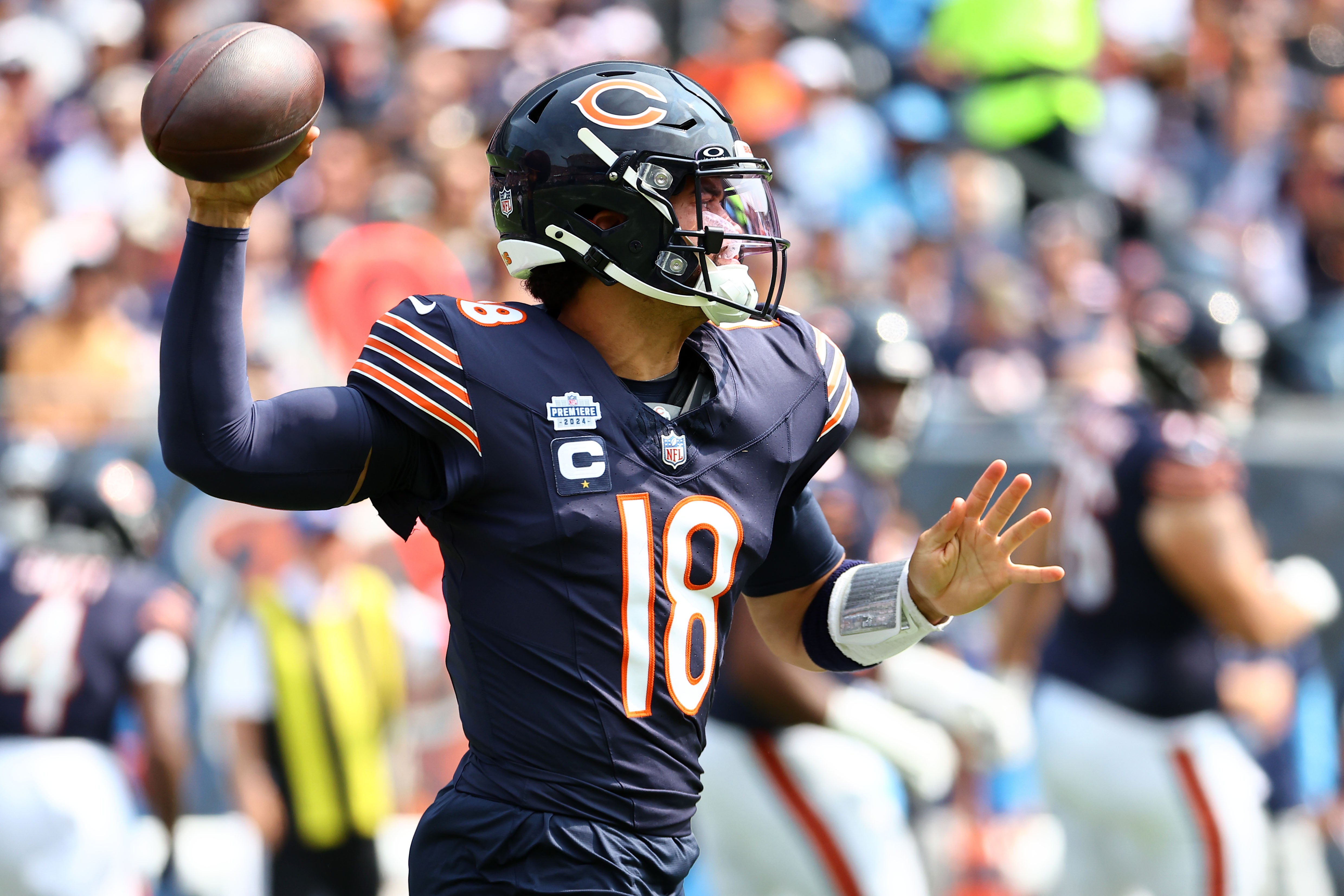Sep 8, 2024; Chicago, Illinois, USA; Chicago Bears quarterback Caleb Williams (18) drops back to pass against the Tennessee Titans during the second quarter at Soldier Field.