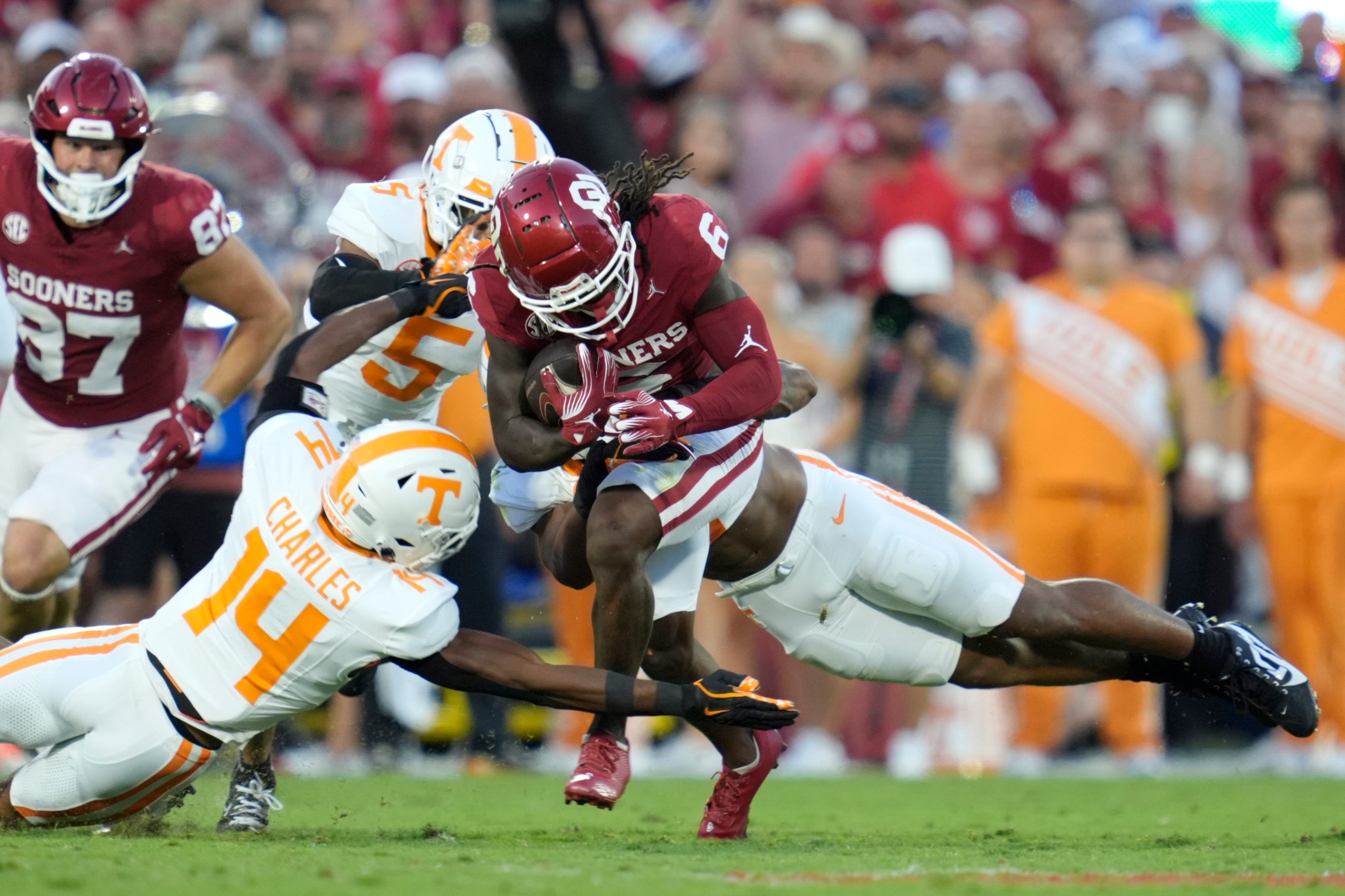 Oklahoma Sooners wide receiver Deion Burks (6) tries to get past Tennessee Volunteers defensive back Christian Charles (14) during a college football game between the University of Oklahoma Sooners (OU) and the Tennessee Volunteers at Gaylord Family - Oklahoma Memorial Stadium in Norman, Okla., Saturday, Sept. 21, 2024.