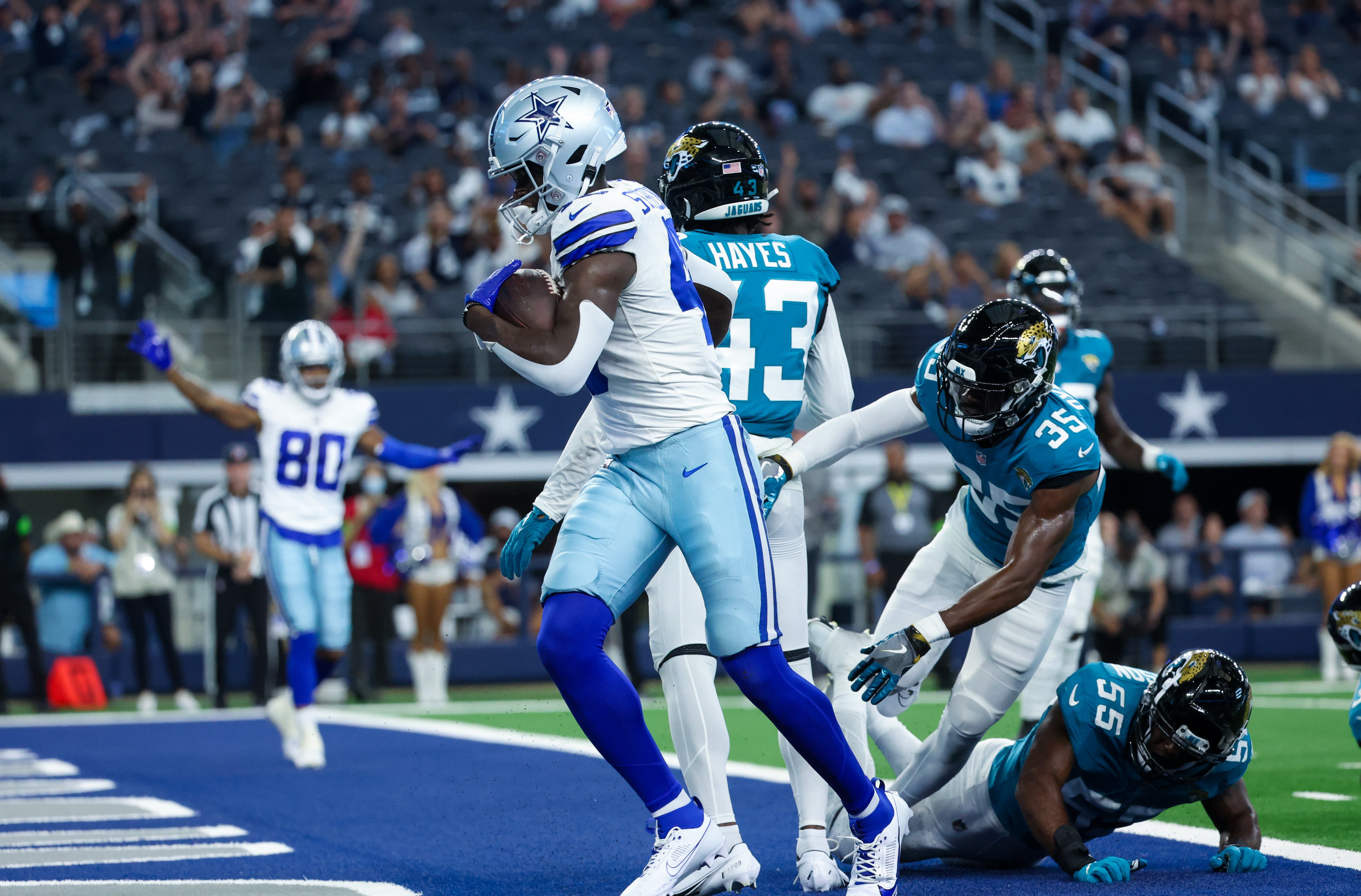 Dallas Cowboys wide receiver John Stephens Jr. (49) scores a touchdown during the second half against the Jacksonville Jaguars at AT&T Stadium.