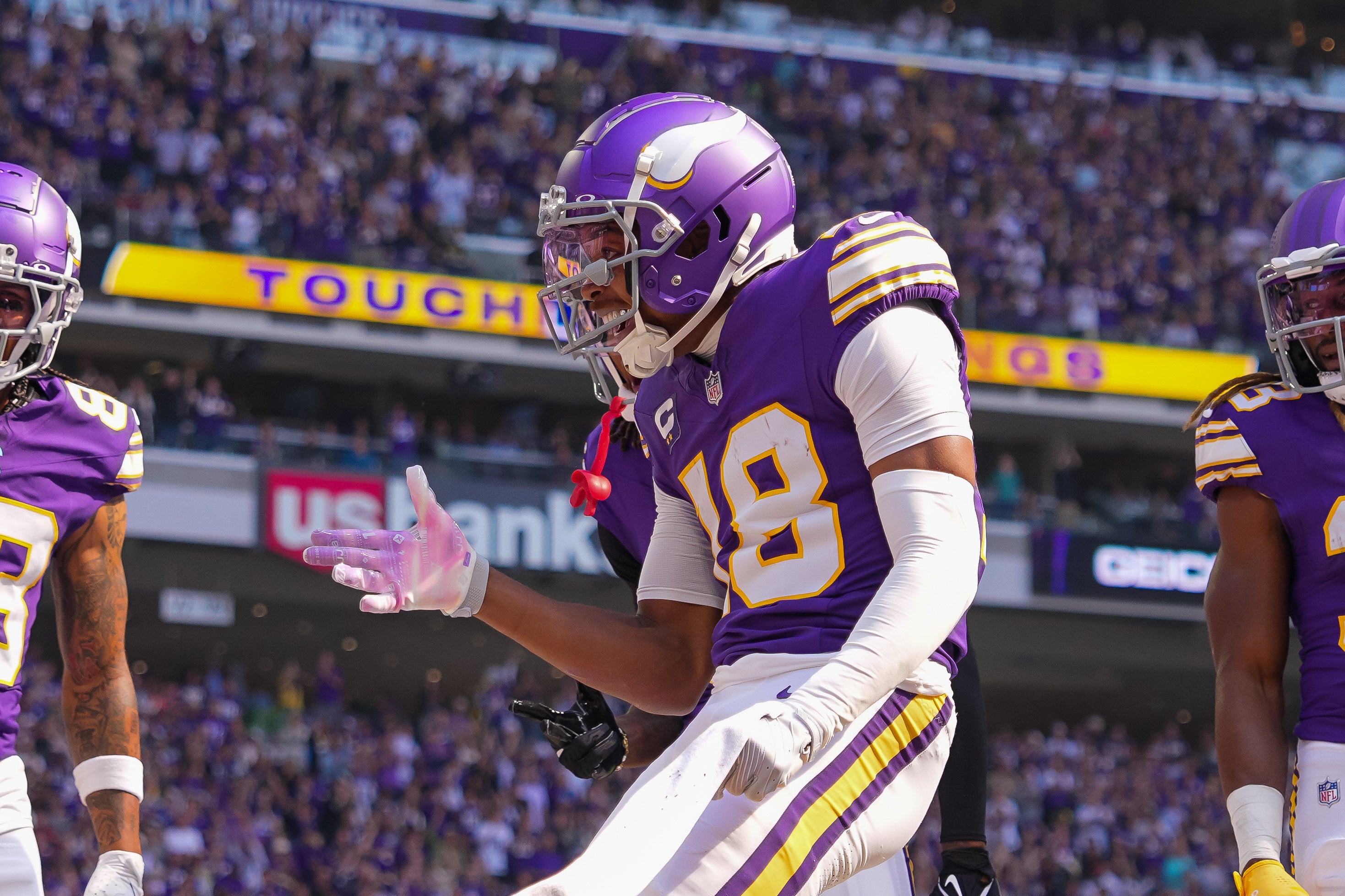 Sep 22, 2024; Minneapolis, Minnesota, USA; Minnesota Vikings wide receiver Justin Jefferson (18) celebrates his touchdown against the Houston Texans in the first quarter at U.S. Bank Stadium.