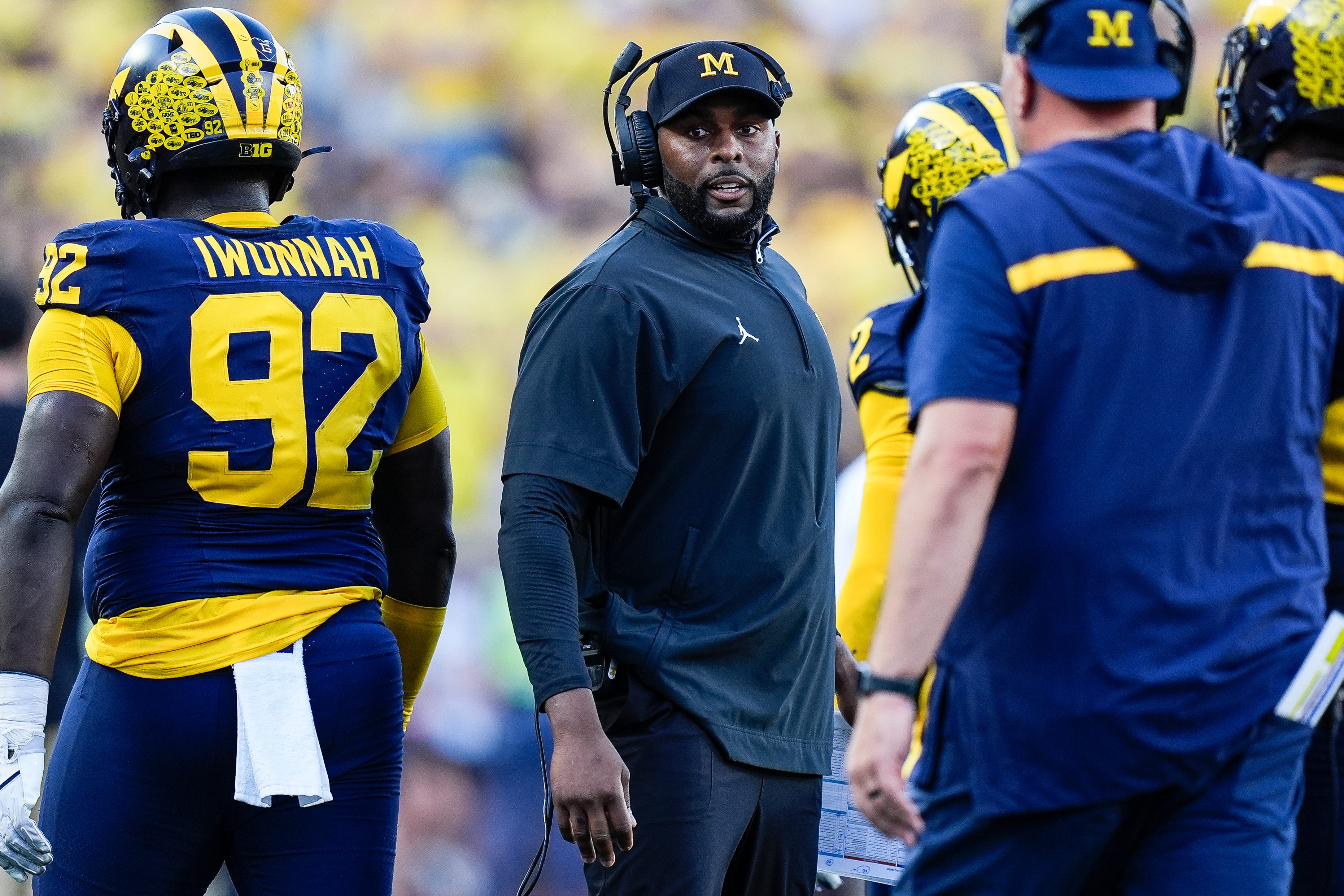 Michigan head coach Sherrone Moore talks to players at a timeout against USC during the second half at Michigan Stadium in Ann Arbor on Saturday, Sept. 21, 2024.