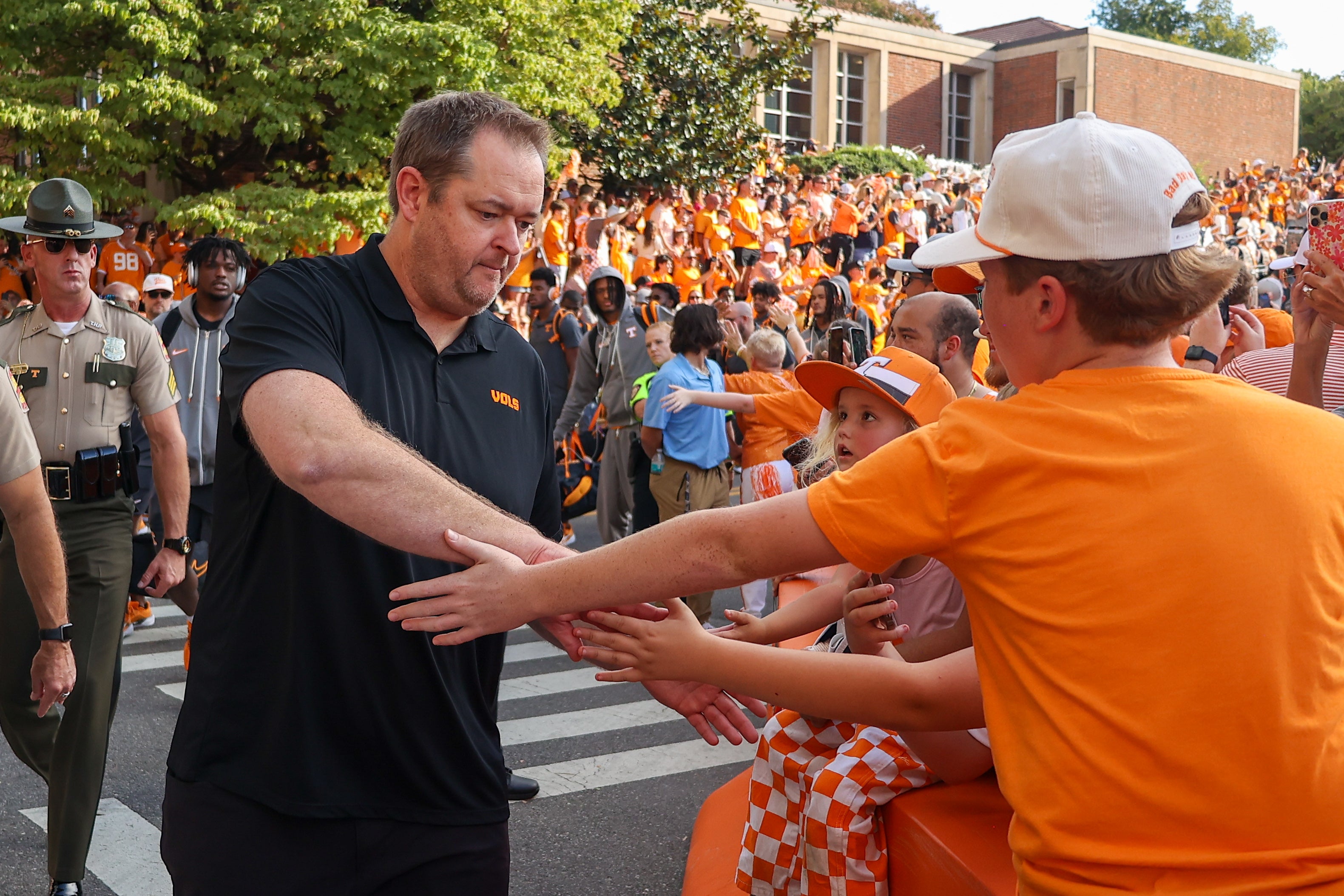 Sep 14, 2024; Knoxville, Tennessee, USA; Tennessee Volunteers head coach Josh Heupel greets fans during the Vol Walk prior to a game against the Kent State Golden Flashes at Neyland Stadium.