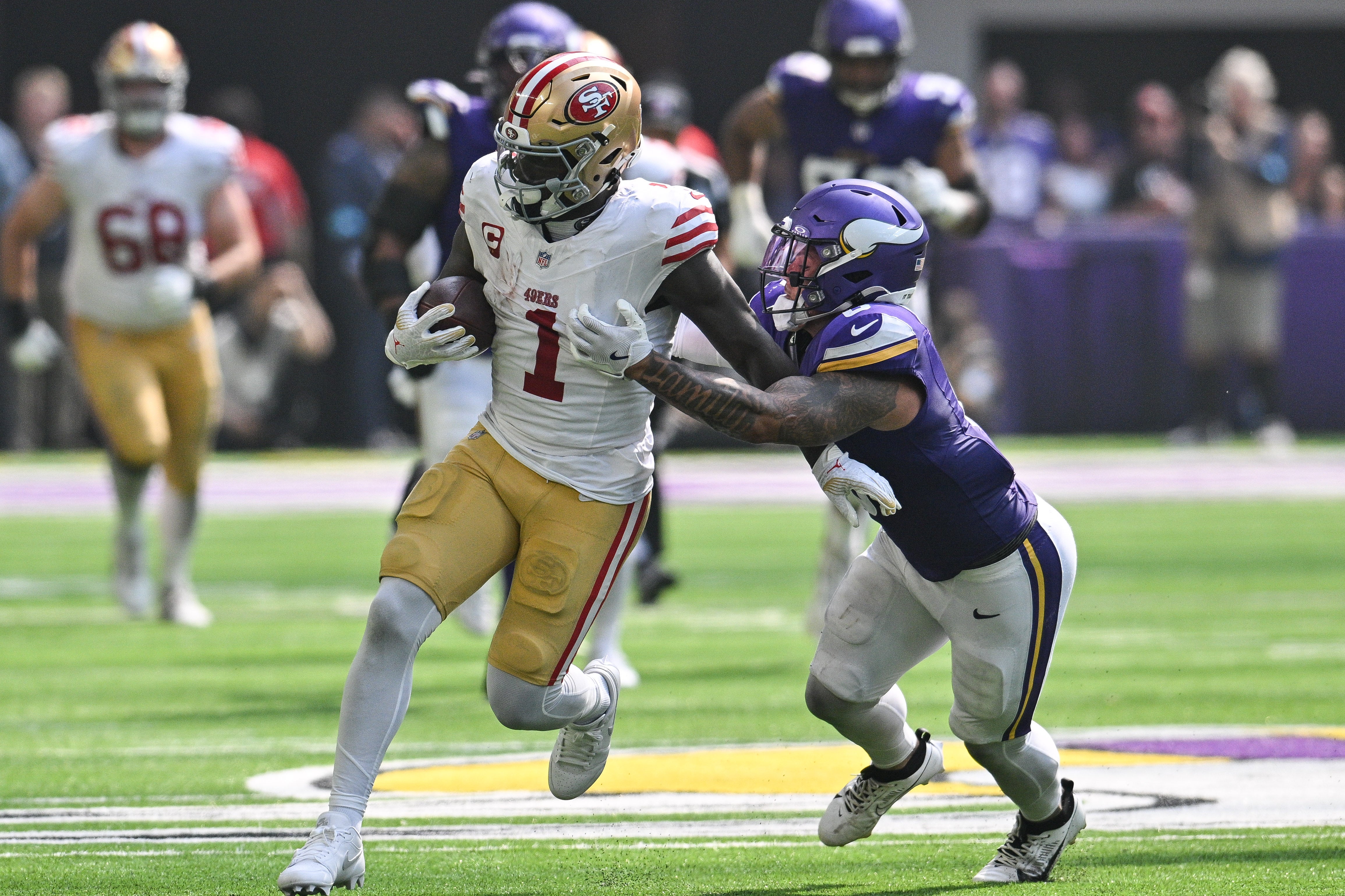 Sep 15, 2024; Minneapolis, Minnesota, USA; San Francisco 49ers wide receiver Deebo Samuel Sr. (1) gets yards after the catch as Minnesota Vikings linebacker Ivan Pace Jr. (0) makes the tackle during the second quarter U.S. Bank Stadium.