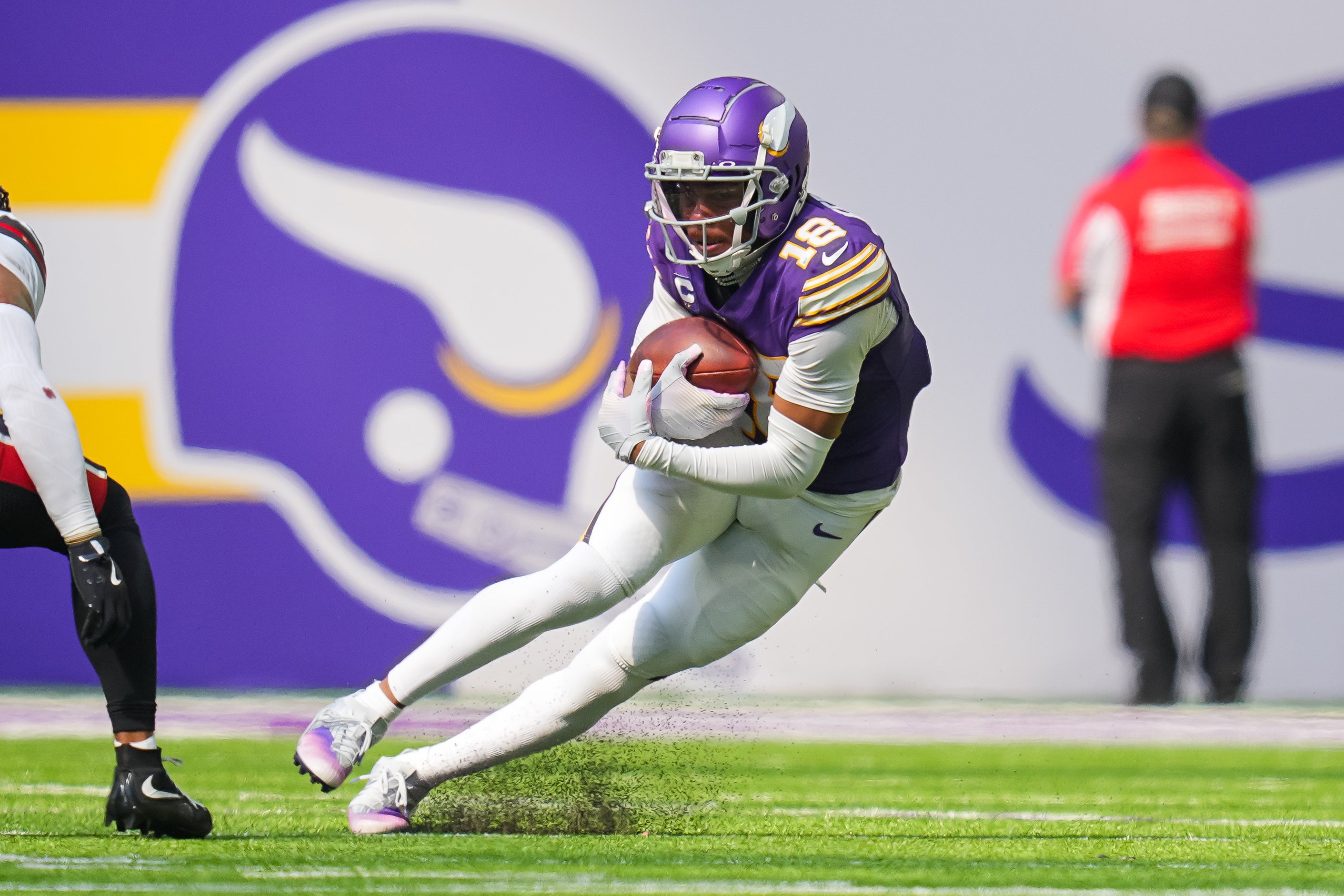 Sep 22, 2024; Minneapolis, Minnesota, USA; Minnesota Vikings wide receiver Justin Jefferson (18) runs after the catch against the Houston Texans in the second quarter at U.S. Bank Stadium.