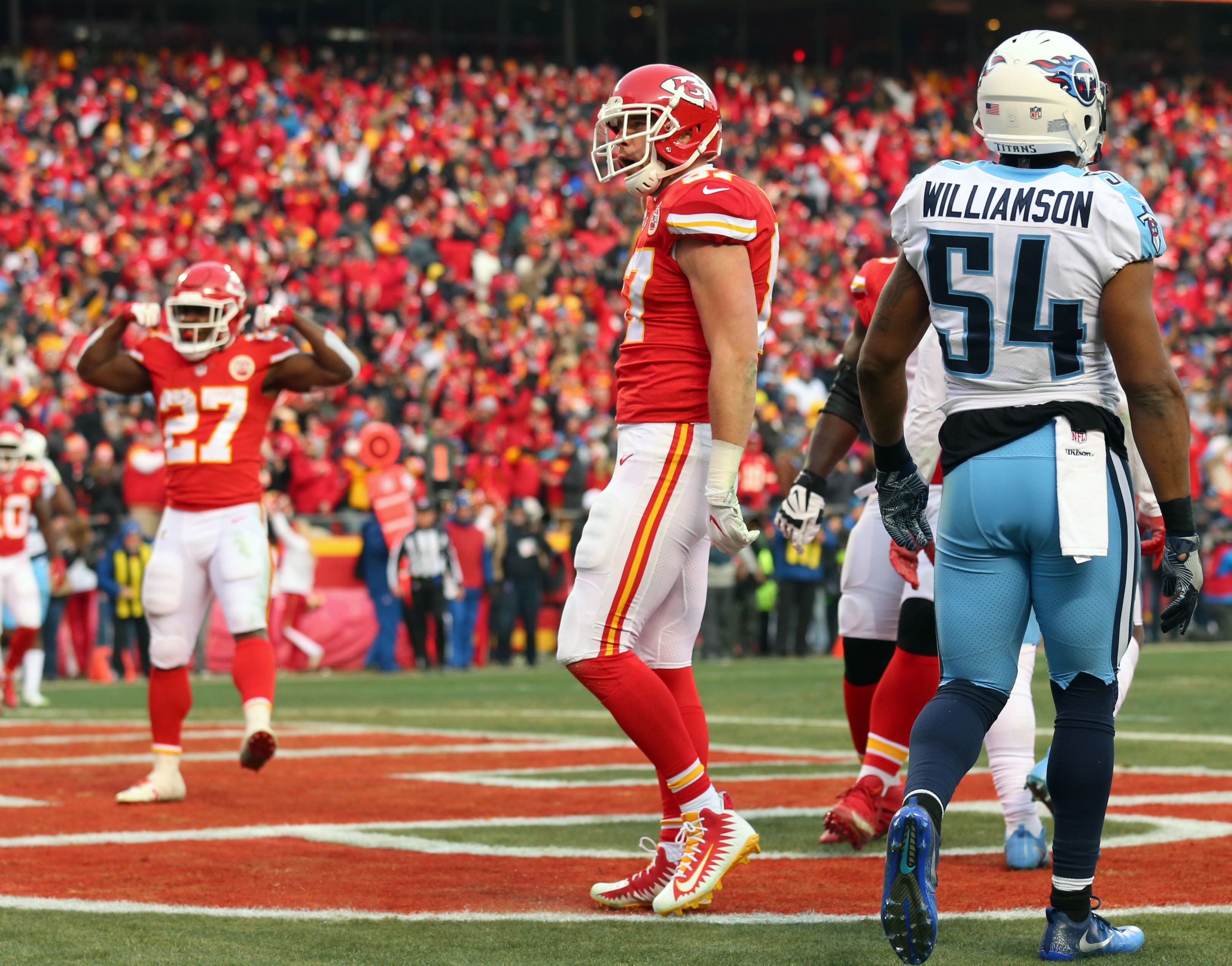 Jan 6, 2018; Kansas City, MO, USA; Kansas City Chiefs tight end Travis Kelce (87) and running back Kareem Hunt (27) celebrate after a touchdown against the Tennessee Titans during the first half in the AFC Wild Card playoff football game at Arrowhead Stadium.
