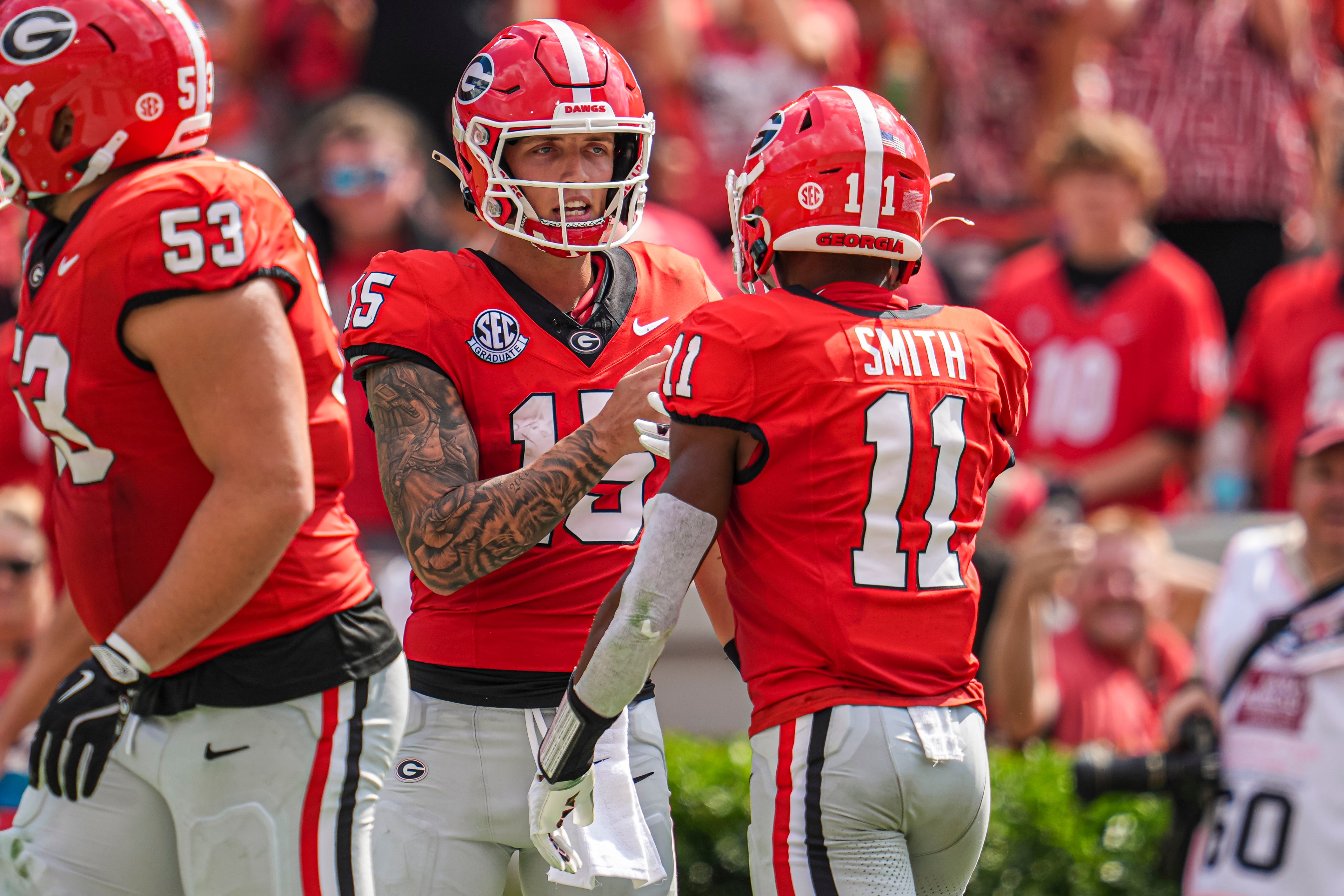 Georgia Bulldogs wide receiver Arian Smith (11) reacts with quarterback Carson Beck (15) after they combined on a touchdown pass against the Tennessee Tech Golden Eagles during the second half at Sanford.