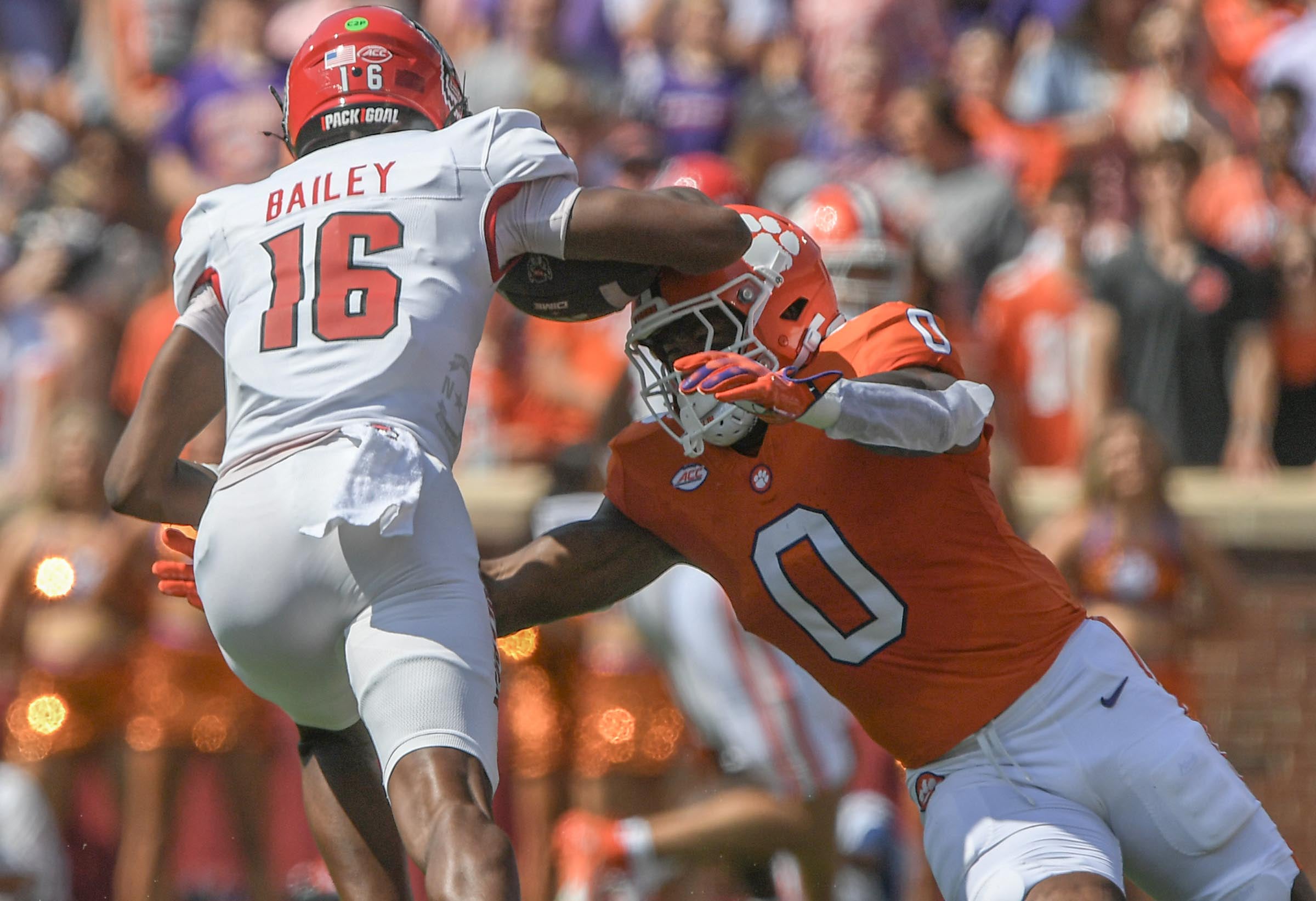 Sep 21, 2024; Clemson, South Carolina, USA; Clemson Tigers linebacker Barrett Carter (0) tackles North Carolina State Wolfpack University quarterback CJ Bailey (16) during the first quarter at Memorial Stadium.