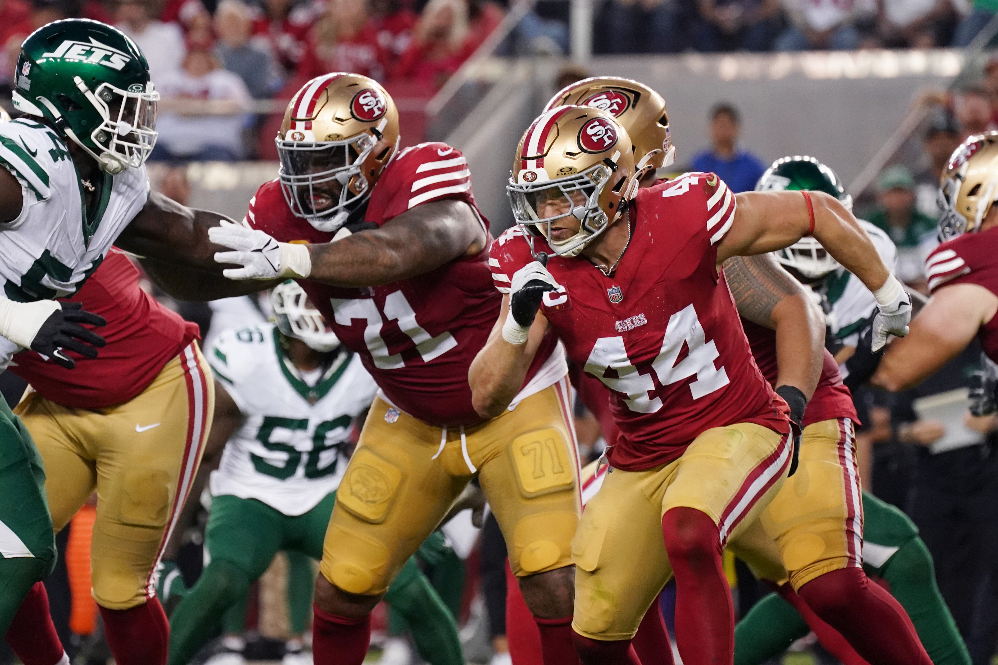 San Francisco 49ers fullback Kyle Juszczyk (44) run blocks with San Francisco 49ers offensive tackle Trent Williams (71) in the third quarter against the New York Jets at Levi's Stadium.