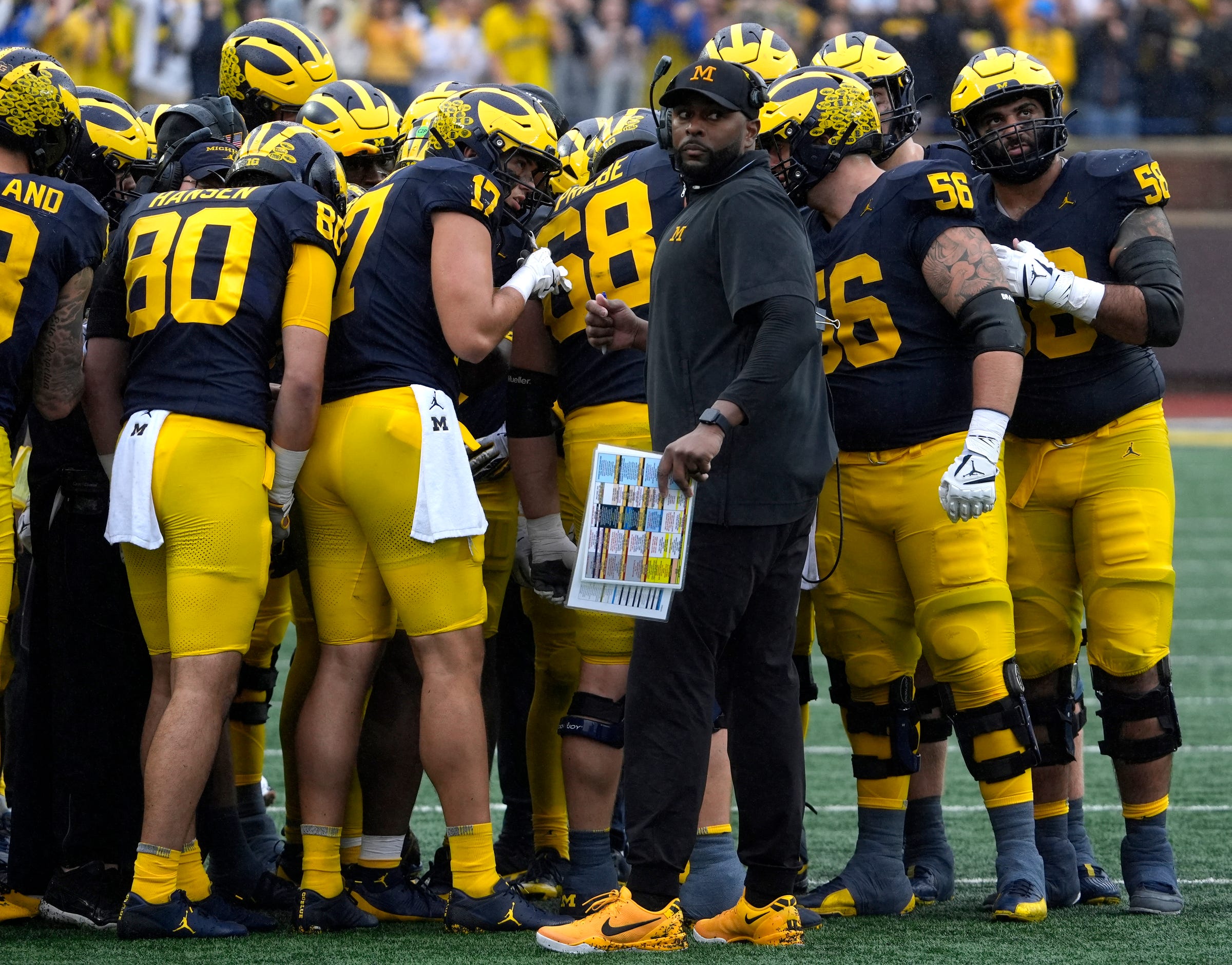 Michigan football coach Sherrone Moore looks at the ref during a time out during first-half action between Michigan and Minnesota at Michigan Stadium in Ann Arbor on Saturday, Sept. 28, 2024.