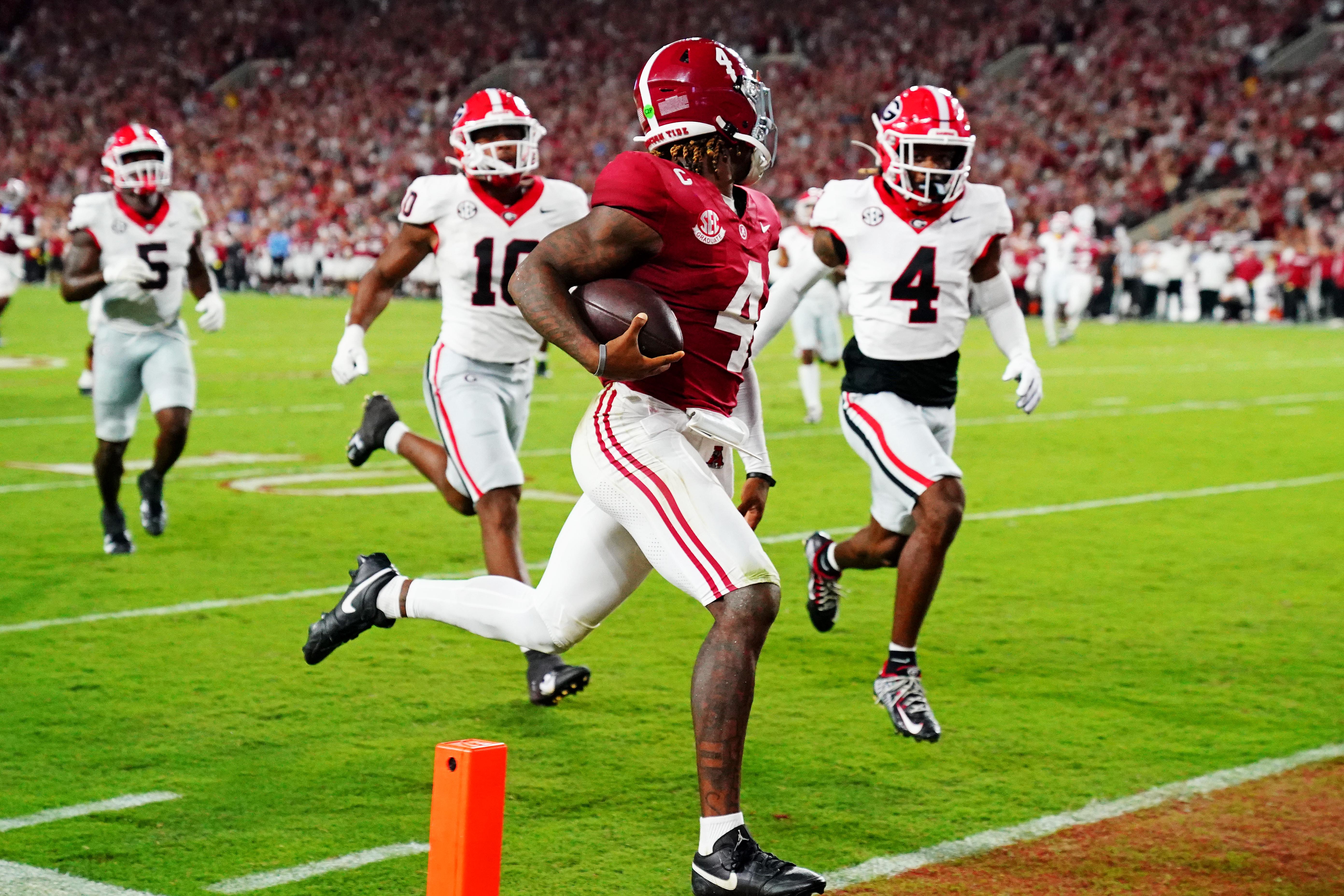 Sep 28, 2024; Tuscaloosa, Alabama, USA; Alabama Crimson Tide quarterback Jalen Milroe (4) scores a touchdown during the second quarter against the Georgia Bulldogs at Bryant-Denny Stadium.