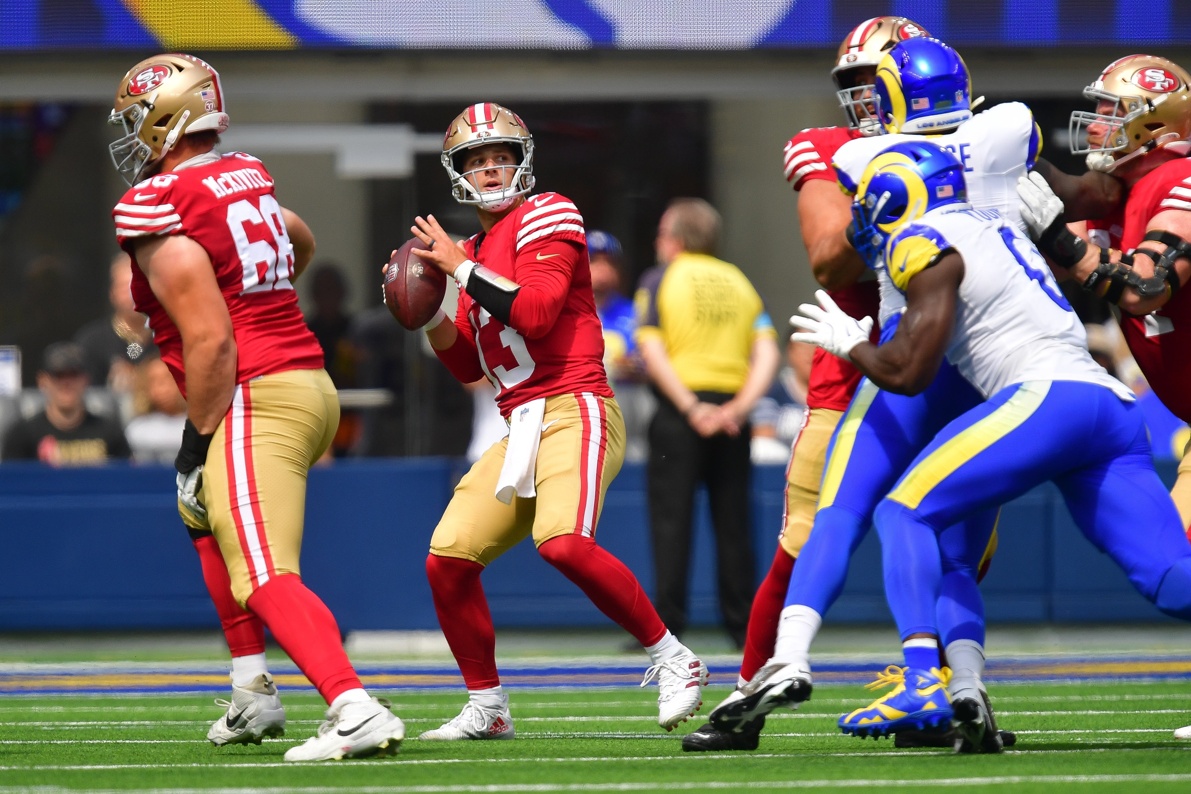 San Francisco 49ers quarterback Brock Purdy (13) drops back to pass against the Los Angeles Rams during the first half at SoFi Stadium.