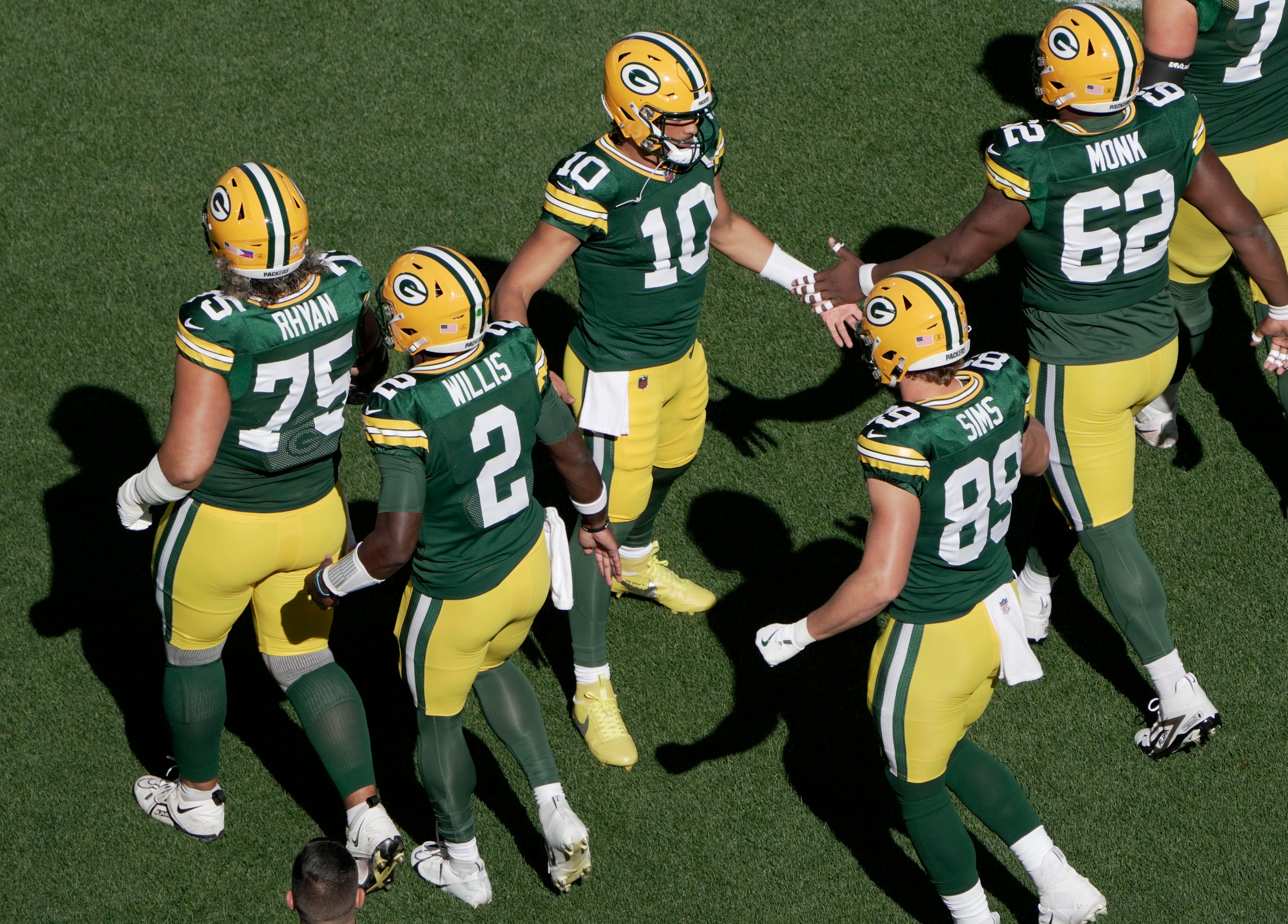 Green Bay Packers quarterback Jordan Love (10) gathers his teammates before their game against the Minnesota Vikings Sunday, September 29, 2024 at Lambeau Field in Green Bay, Wisconsin.