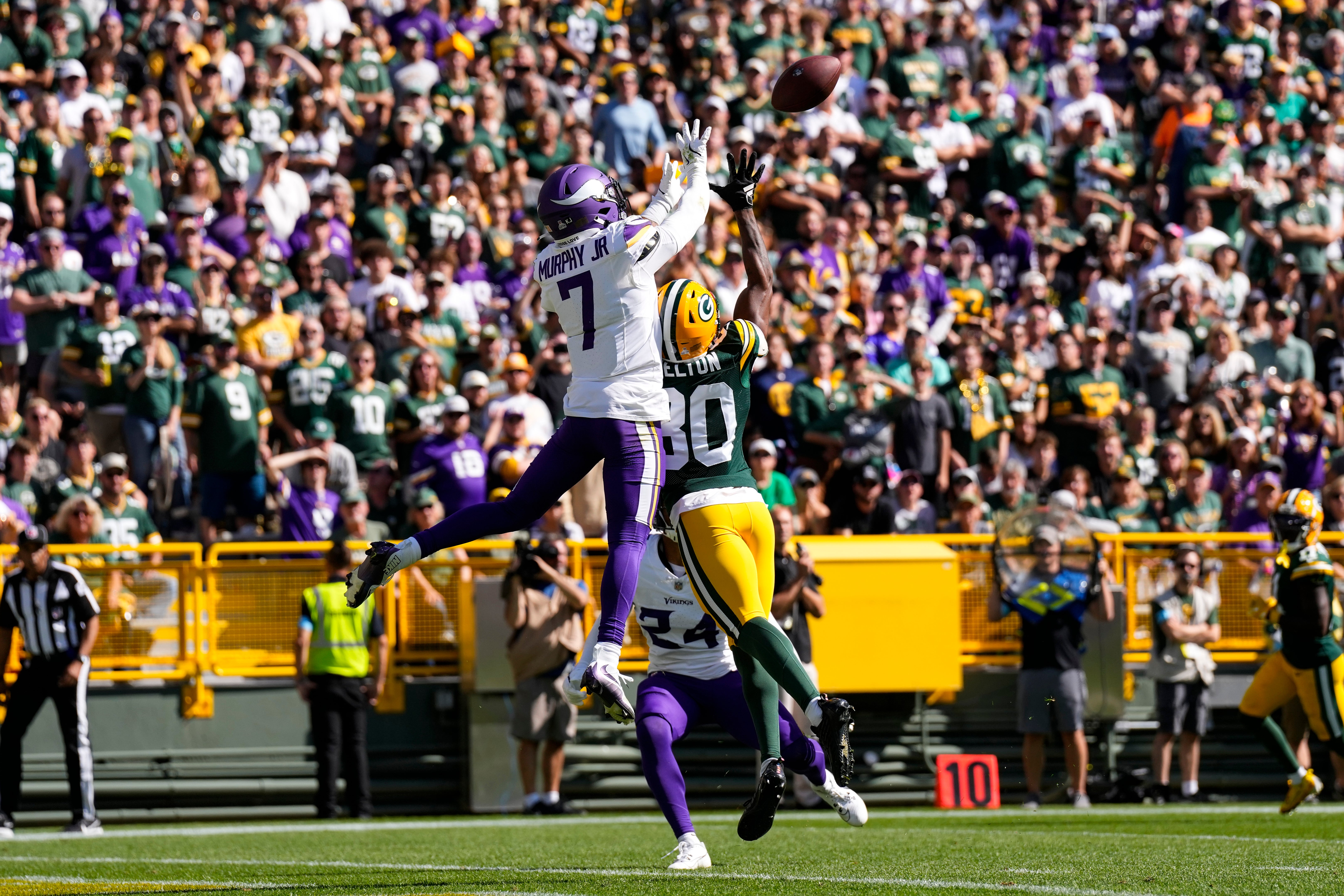 Sep 29, 2024; Green Bay, Wisconsin, USA; Minnesota Vikings cornerback Byron Murphy Jr. (7) breaks up the pass intended for Green Bay Packers wide receiver Bo Melton (80) during the second at Lambeau Field.