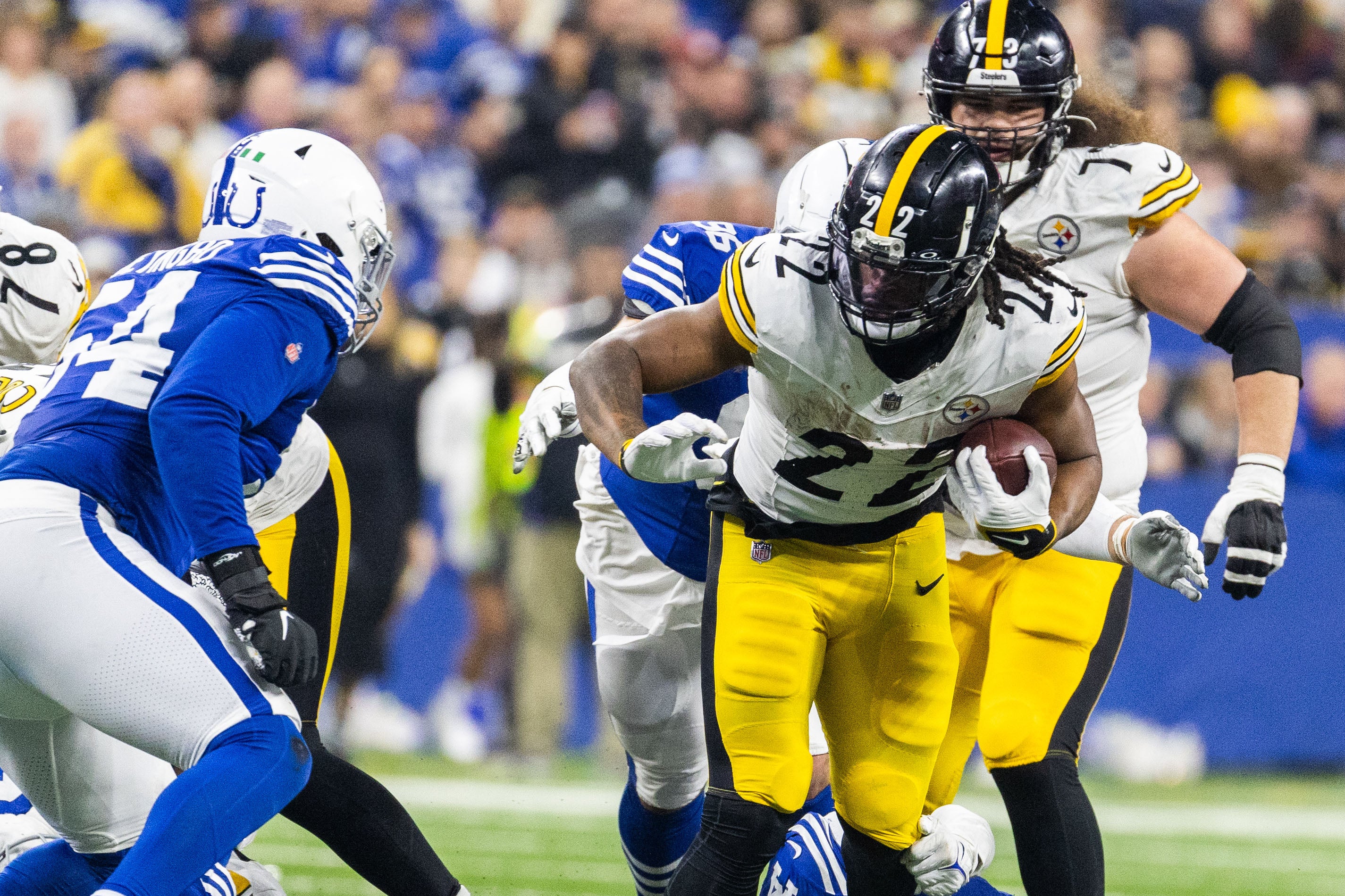 Dec 16, 2023; Indianapolis, Indiana, USA; Pittsburgh Steelers running back Najee Harris (22) runs the ball while Indianapolis Colts linebacker Zaire Franklin (44) defends in the second half at Lucas Oil Stadium.