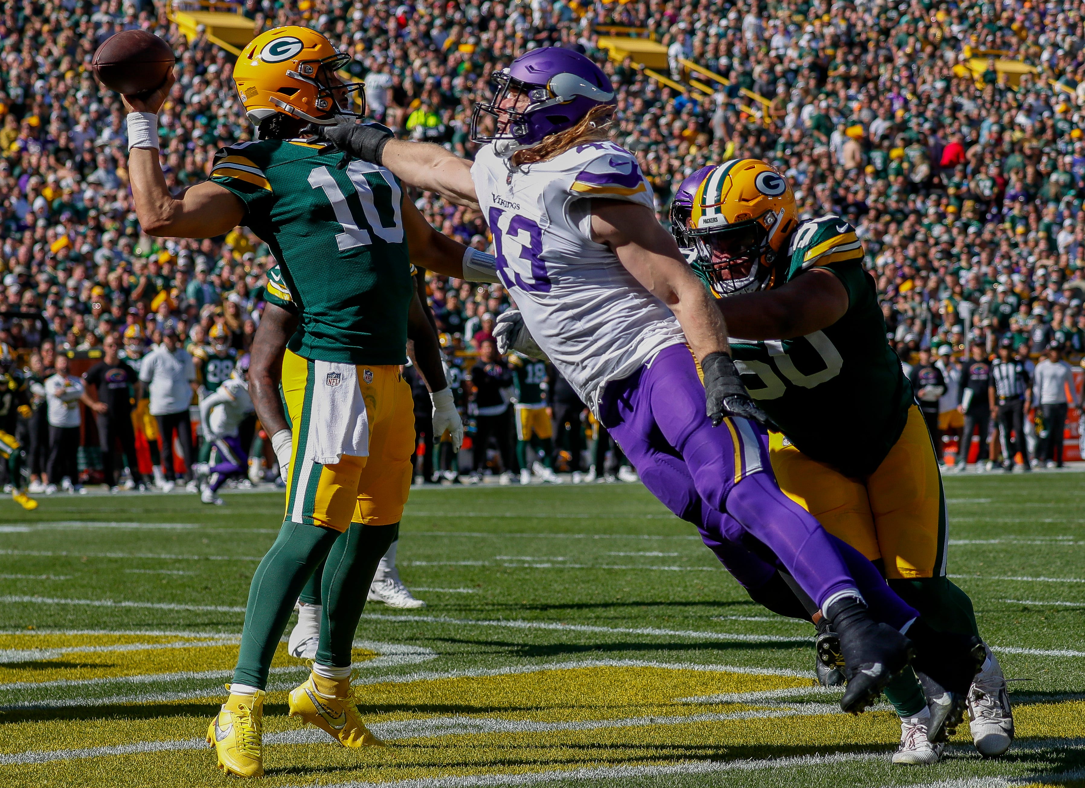 Green Bay Packers quarterback Jordan Love (10) throws the ball away under pressure from Minnesota Vikings linebacker Andrew Van Ginkel (43) on Sunday, September 29, 2024, at Lambeau Field in Green Bay, Wis. The Vikings won the game, 31-29.