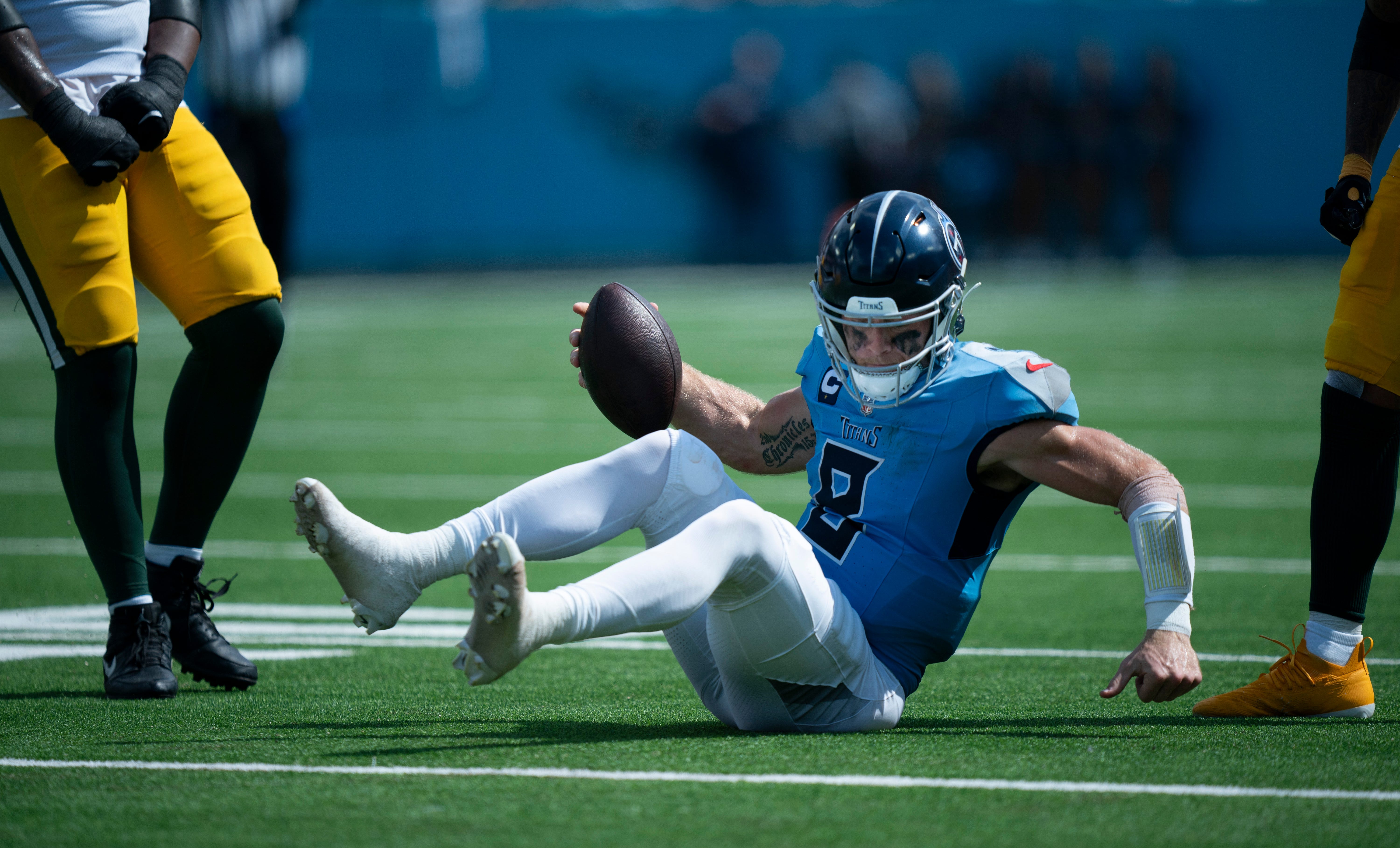 Tennessee Titans quarterback Will Levis (8) picks himself up short of the first down on a fourth-down play after being tackled by Green Bay Packers linebacker Quay Walker (7) in the third quarter duri... Denny Simmons / The Tennessean-USA TODAY NETWORK via Imagn Images