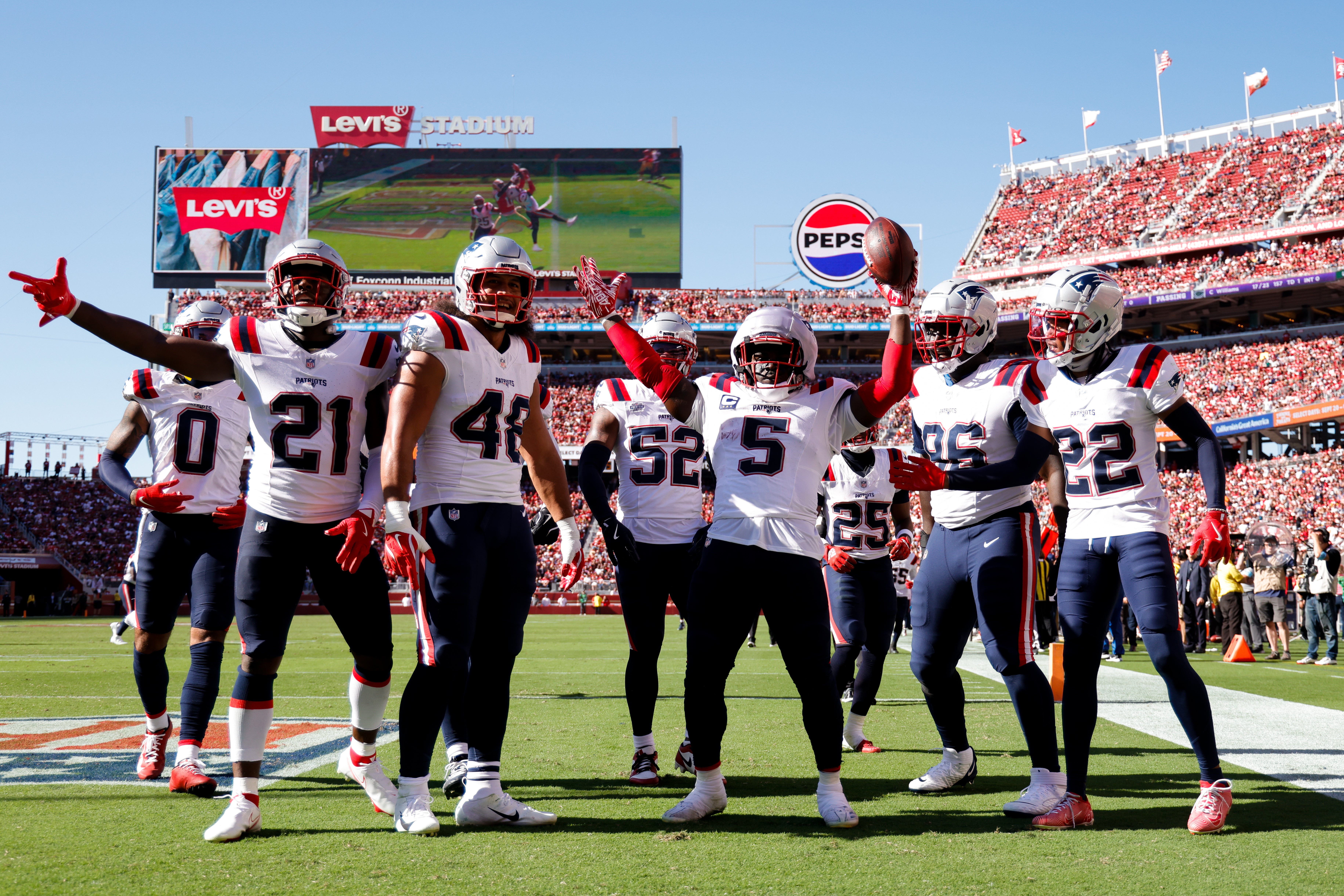 Sep 29, 2024; Santa Clara, California, USA; New England Patriots safety Jabrill Peppers (5) celebrates with teammates after intercepting a pass during the fourth quarter against the San Francisco 49ers at Levi's Stadium.