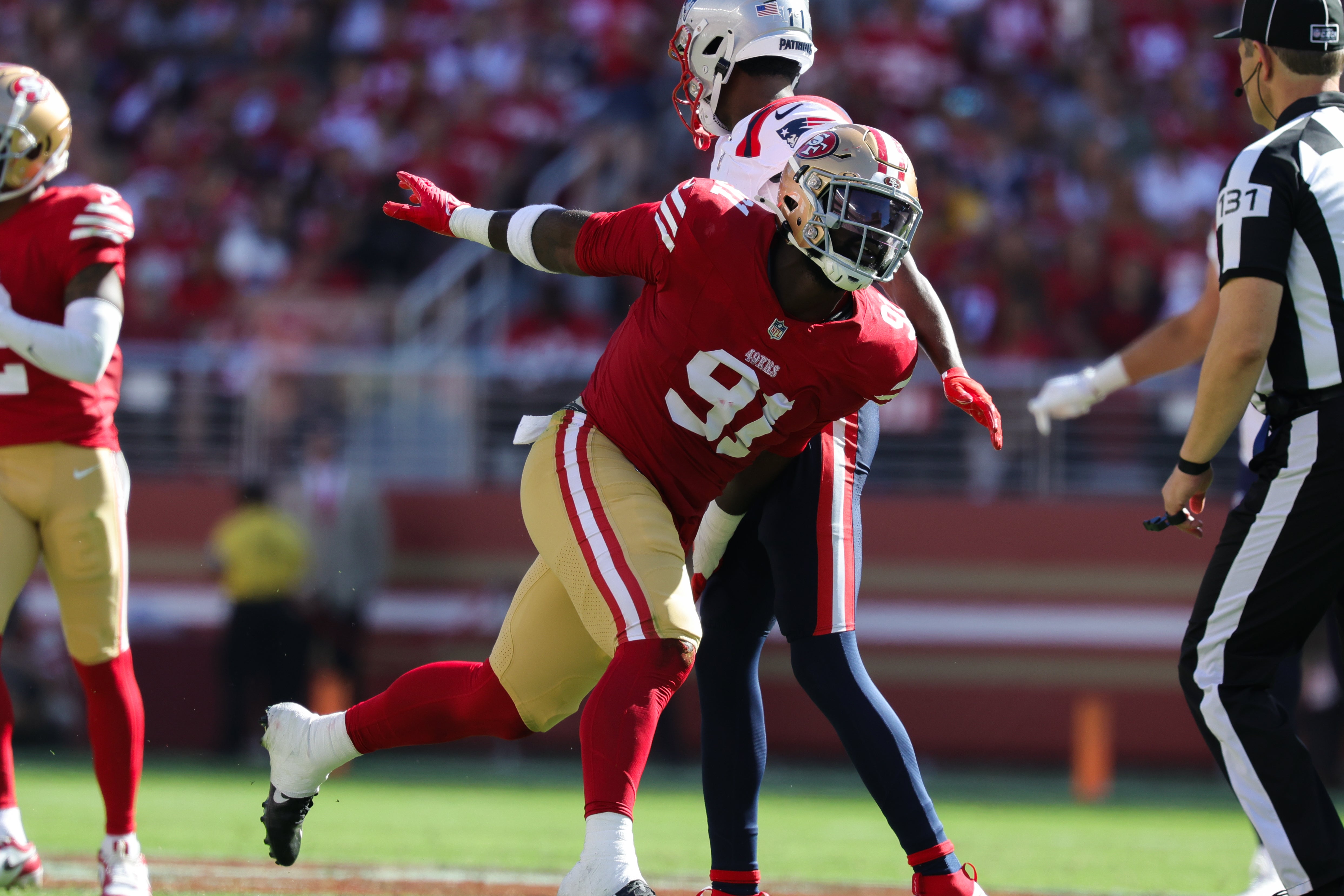 San Francisco 49ers defensive tackle Sam Okuayinonu (91) celebrates after a play against the New England Patriots during the fourth quarter at Levi's Stadium.