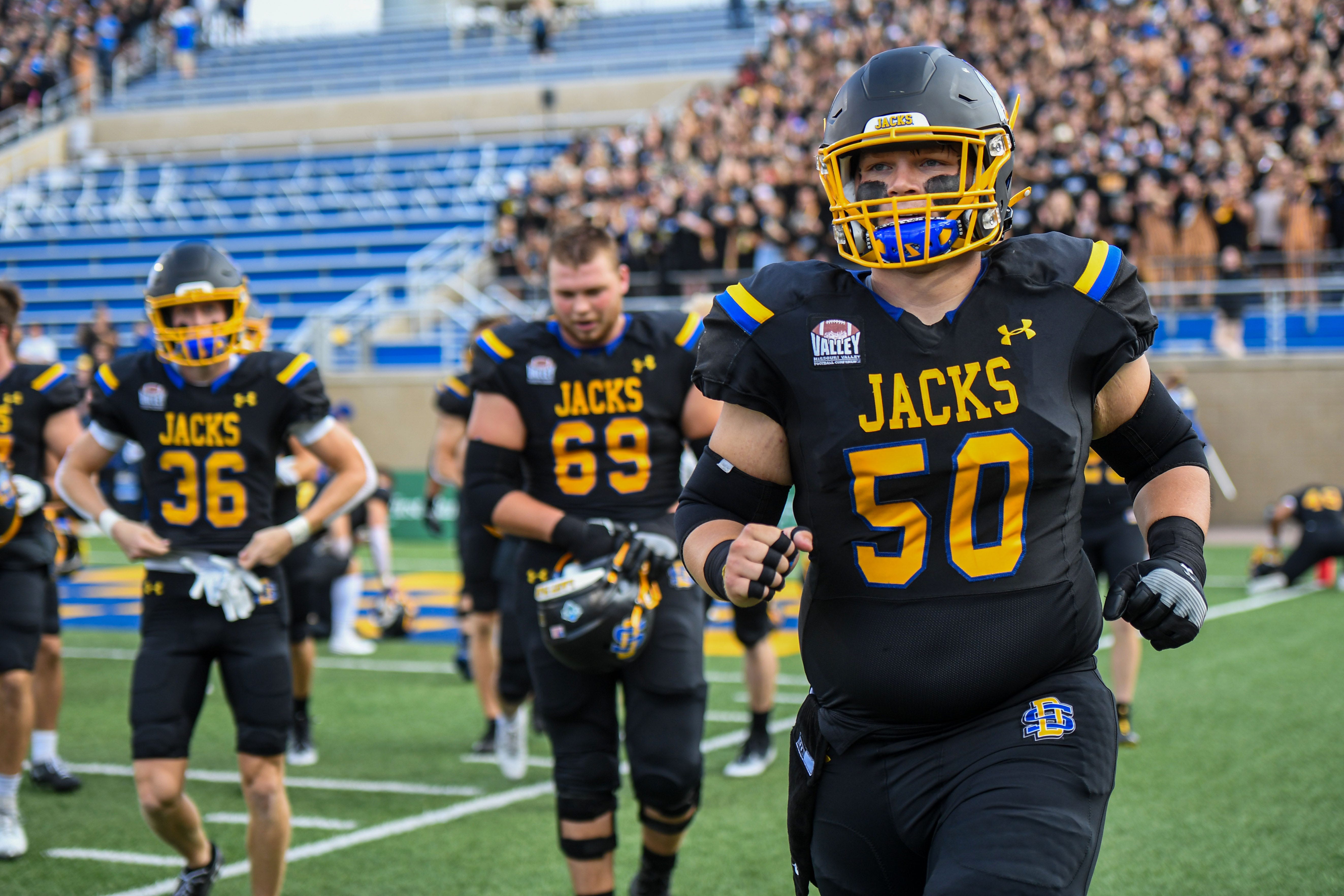 SDSU's Nick Wells (50) runs on the football field before the game against Montana State from 2023.