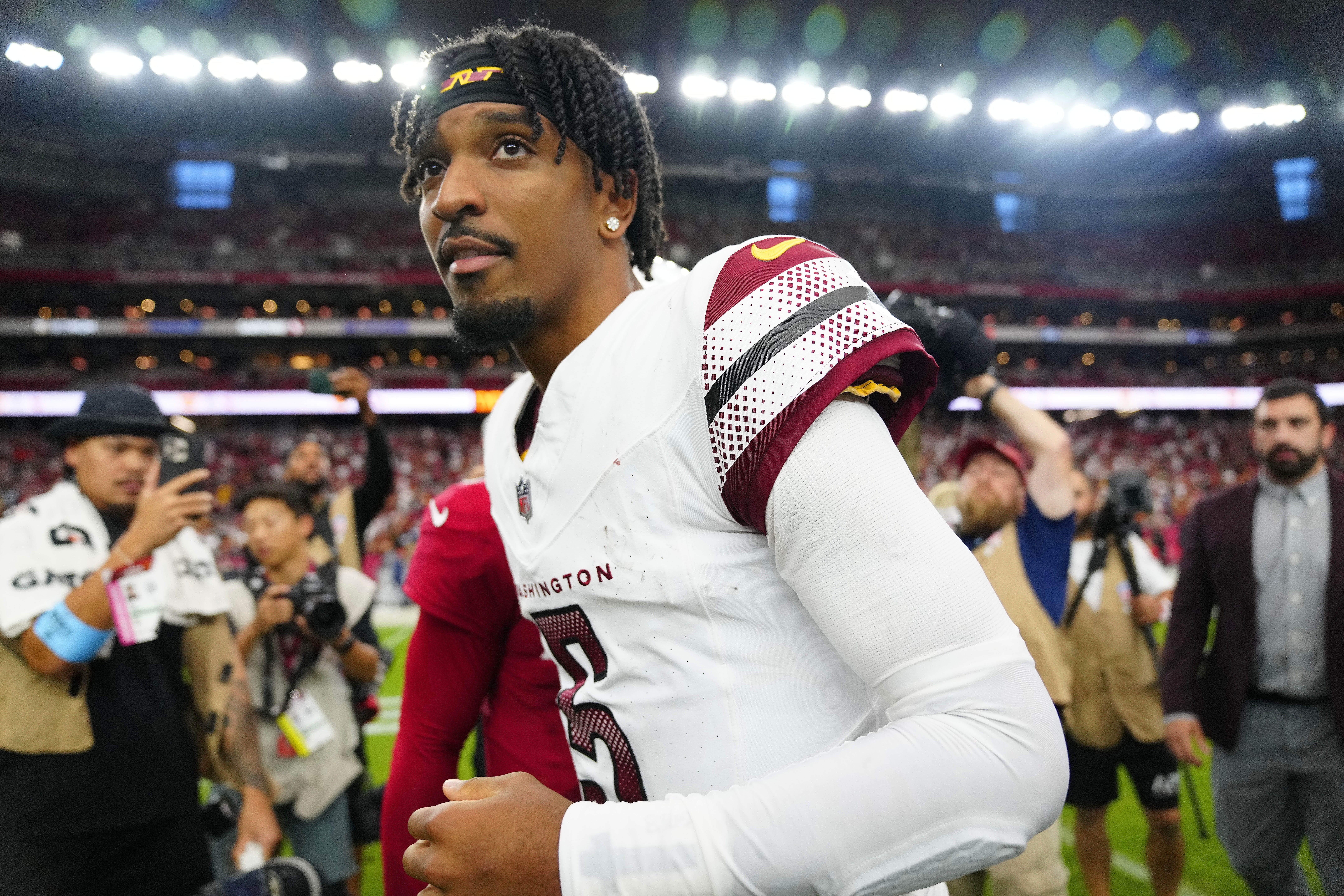 Washington quarterback Jayden Daniels leaves the field after defeating the Cardinals during a game at State Farm Stadium in Glendale, on Ariz. Sept 29, 2024.