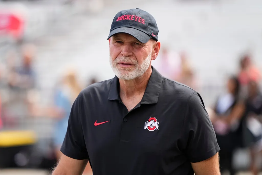 Ohio State Buckeyes defensive coordinator Jim Knowles walks the sideline prior to the NCAA football game against the Akron Zips at Ohio Stadium. Ohio State won 52-6