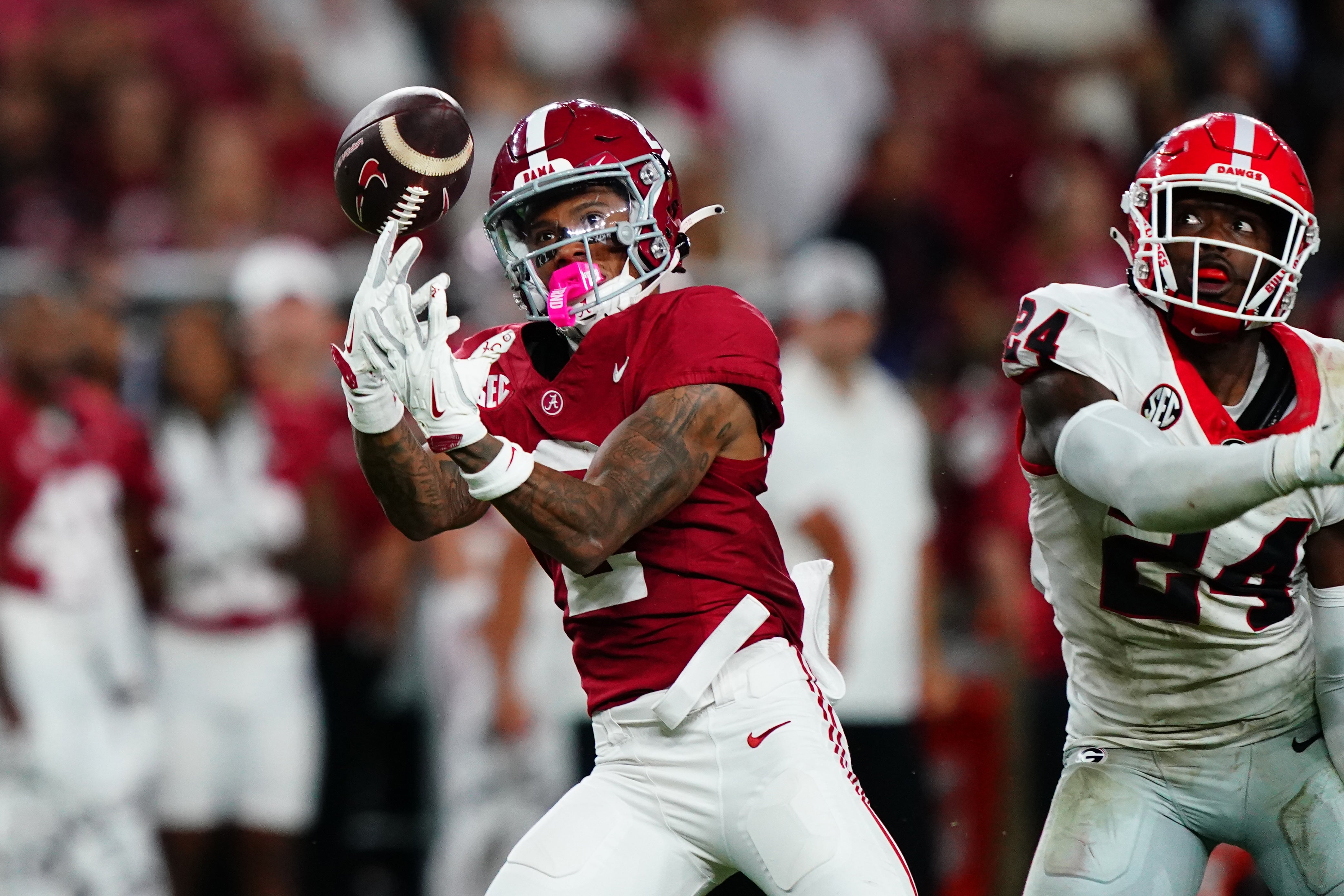 Sep 28, 2024; Tuscaloosa, Alabama, USA; Alabama Crimson Tide wide receiver Ryan Williams (2) reaches for a pass against Georgia Bulldogs defensive back Malaki Starks (24) during the third quarter at Bryant-Denny Stadium.