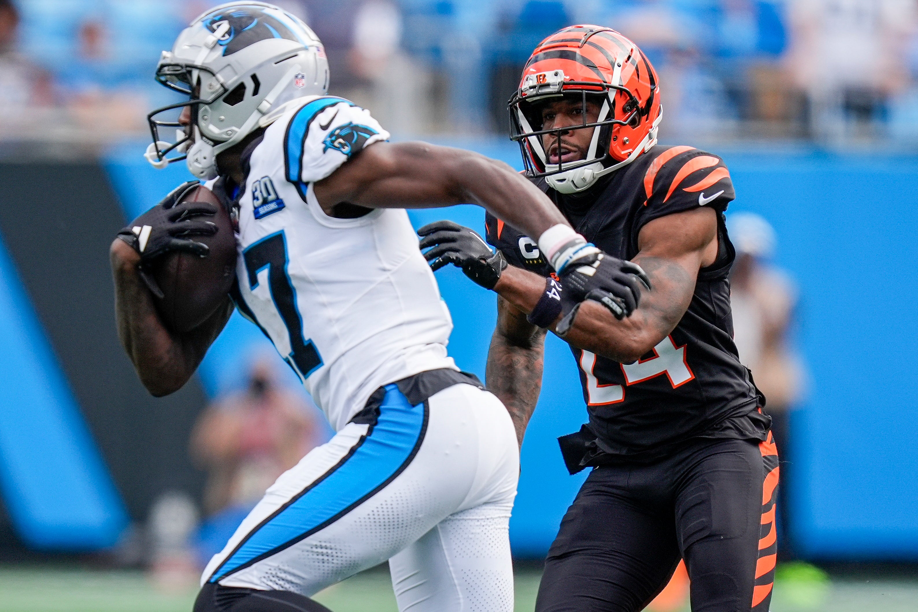Sep 29, 2024; Charlotte, North Carolina, USA; Carolina Panthers wide receiver Xavier Legette (17) runs for yards after catch chased by Cincinnati Bengals safety Vonn Bell (24) during the fourth quarter at Bank of America Stadium.
