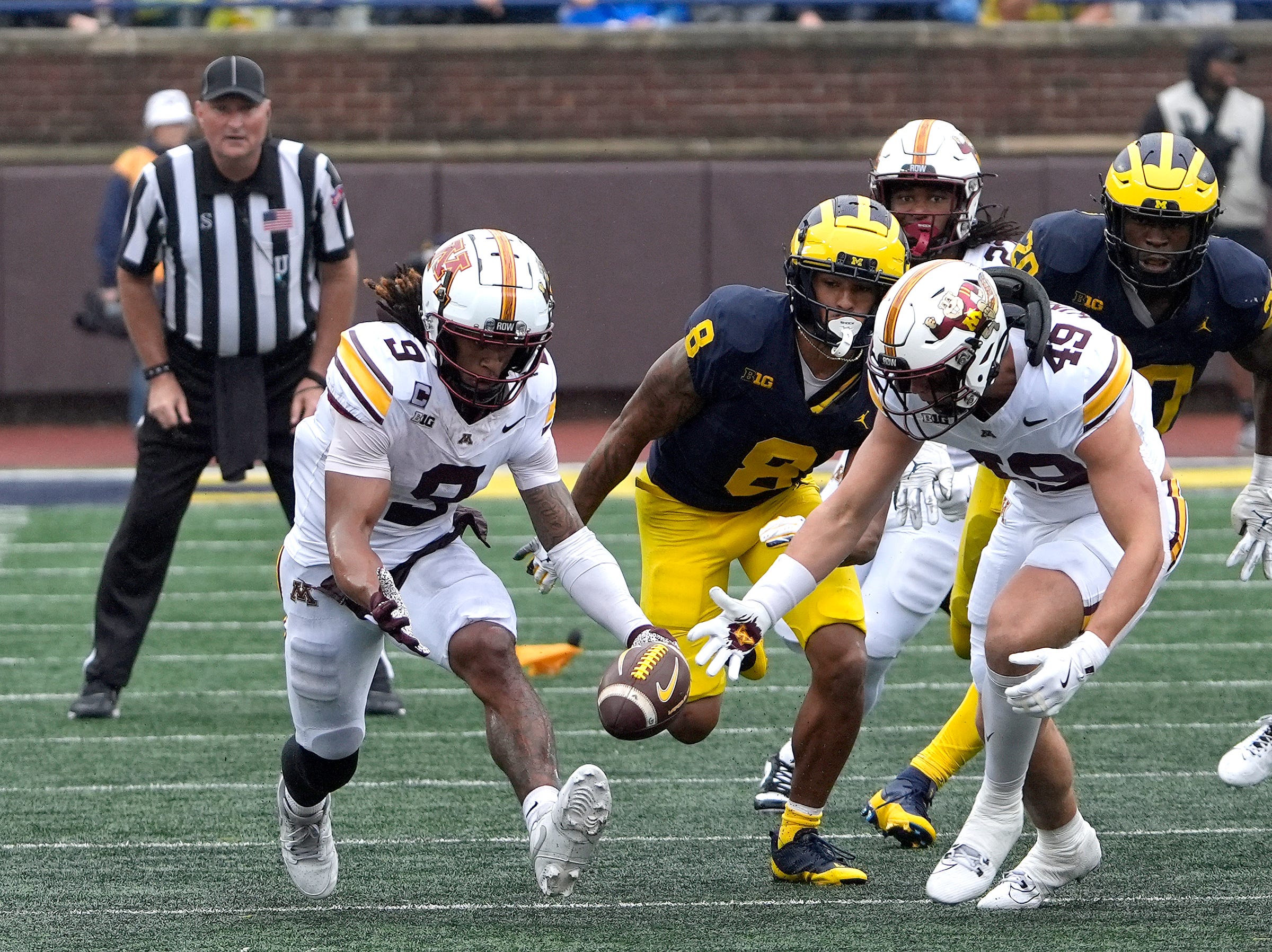 Minnesota wide receiver Daniel Jackson and linebacker Matt Kingsbury converge on the football during a onside kick that got called back because of a flag late in the fourth quarter between Michigan and Minnesota at Michigan Stadium in Ann Arbor on Saturday, Sept. 28, 2024.