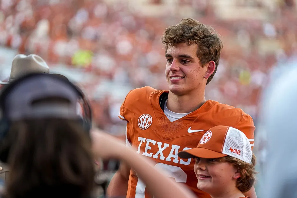 Texas Longhorns quarterback Arch Manning (16) takes a photo with fans after the 35-13 win over Mississippi State at Darrell K Royal-Texas Memorial Stadium in Austin Saturday, Sept. 28, 2024