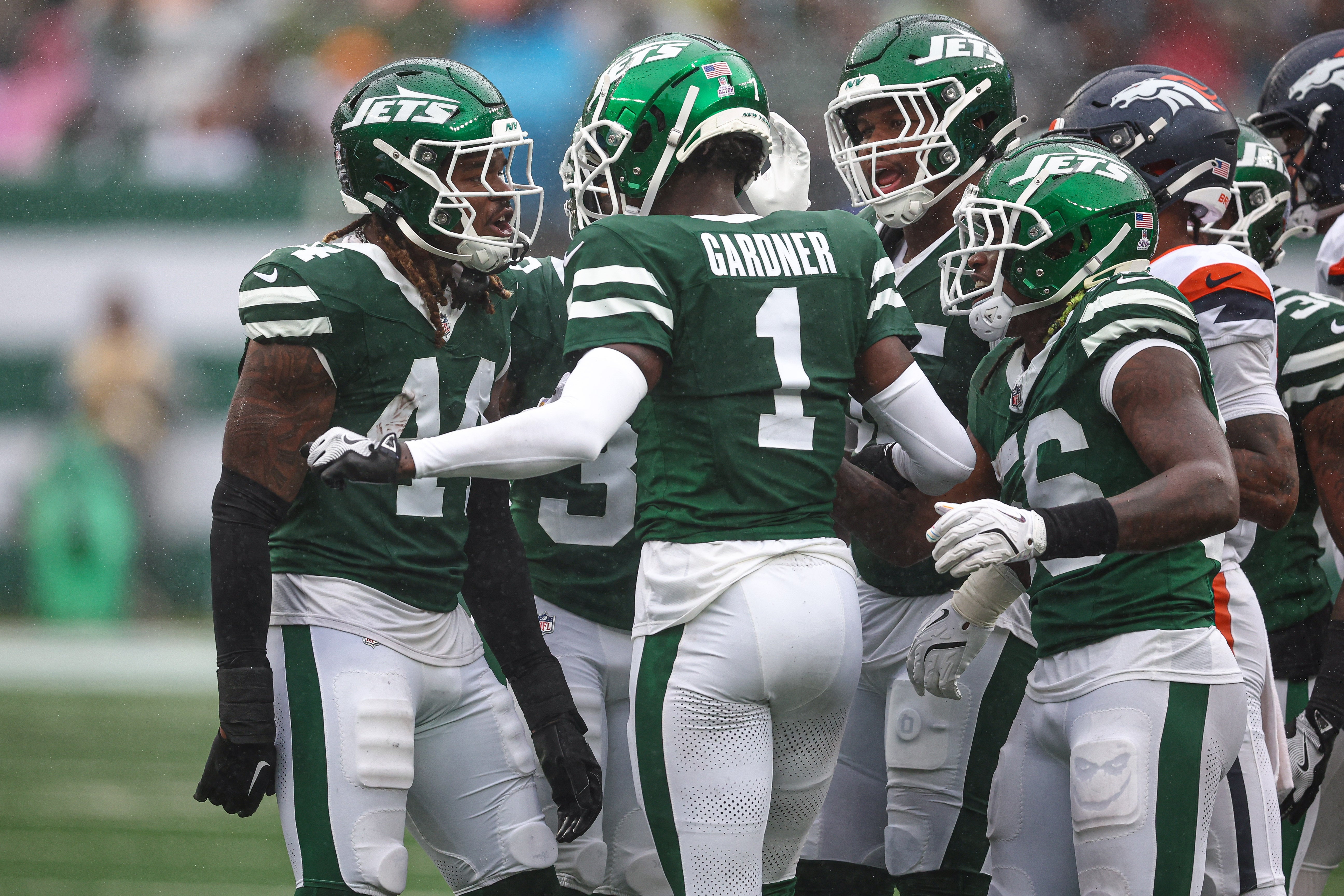 New York Jets linebacker Jamien Sherwood (44) and cornerback Sauce Gardner (1) celebrate a defensive stop during the first half against the Denver Broncos at MetLife Stadium.