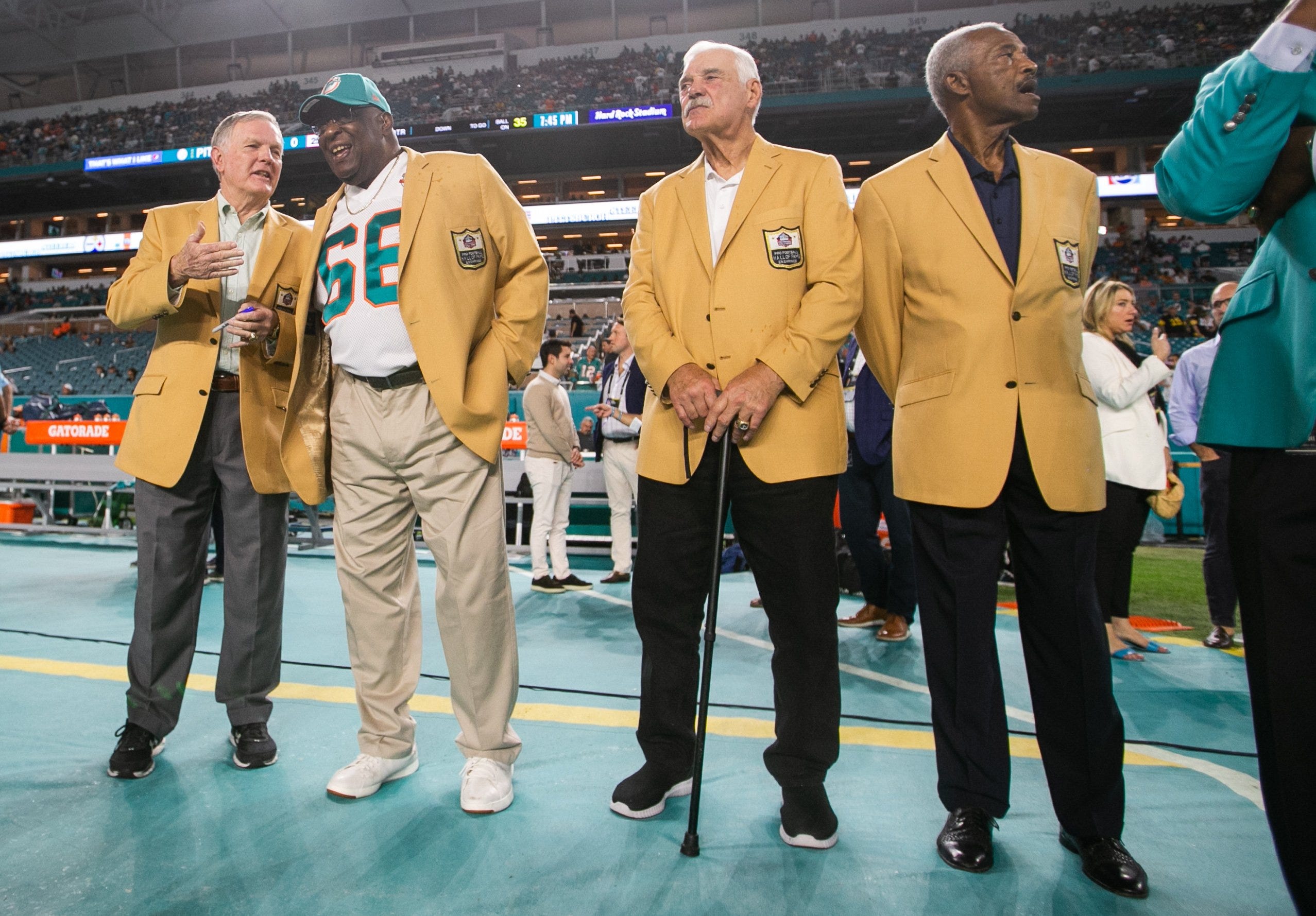 Former members of the 1972 Miami Dolphins Bob Griese, Larry Little, Larry Csonka and Paul Warfield are seen on the sidelines prior to the start of the game between the visiting Pittsburgh Steelers and host Miami Dolphins at Hard Rock Stadium on Sunday, October 23, 2022, in Miami Gardens, FL.