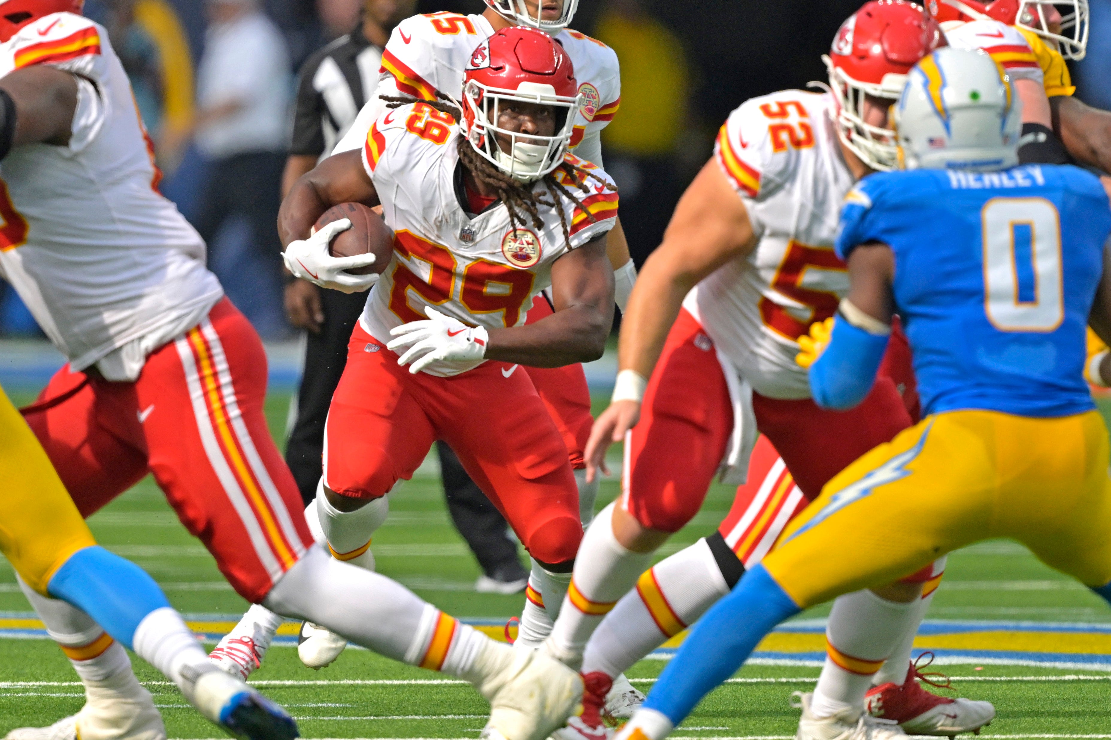 Sep 29, 2024; Inglewood, California, USA; Kansas City Chiefs running back Kareem Hunt (29) carries the ball for a short gain in the second half against the Los Angeles Chargers at SoFi Stadium.
