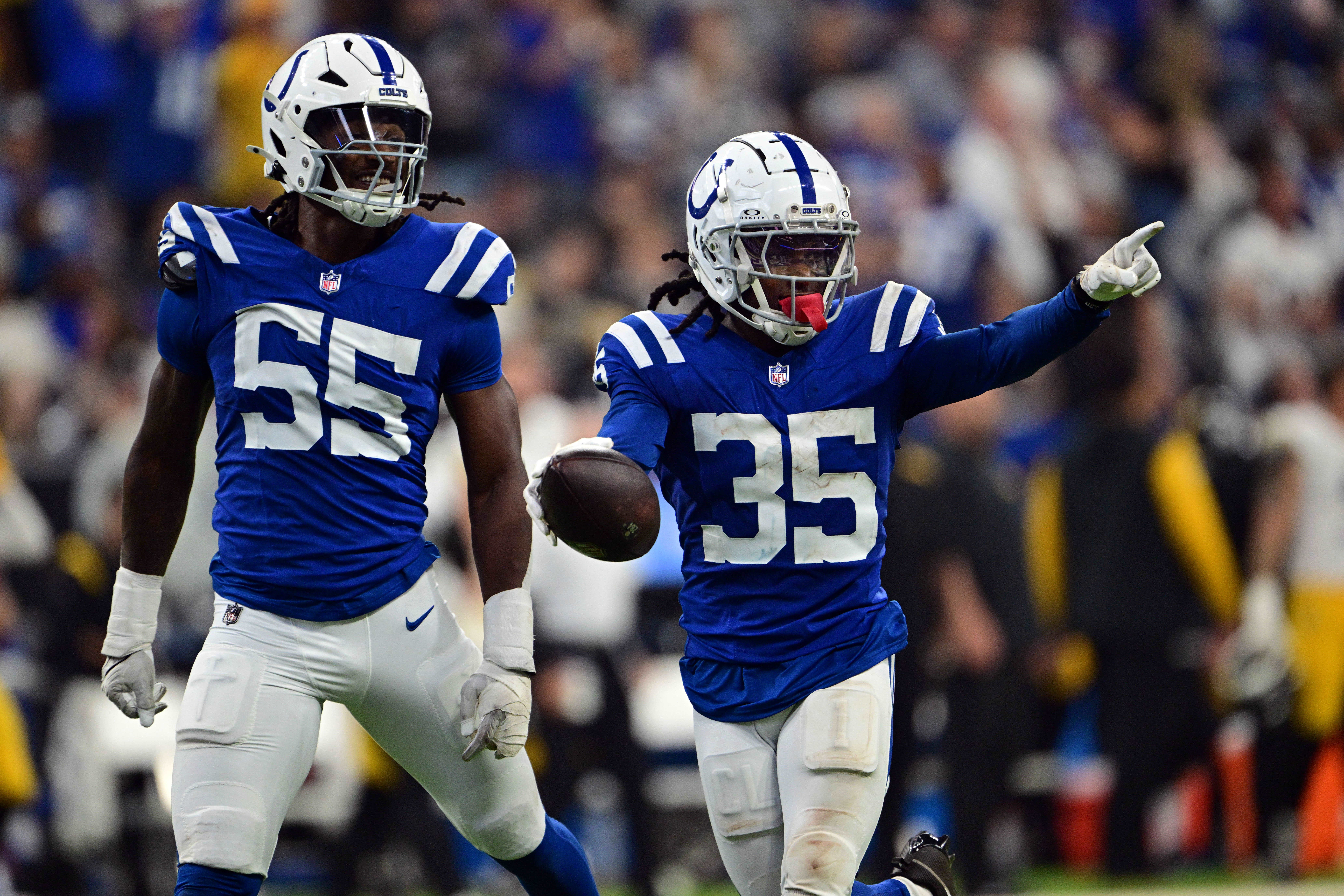 Sep 29, 2024; Indianapolis, Indiana, USA; Indianapolis Colts cornerback Chris Lammons (35) and defensive end Isaiah Land (55) celebrate a fumble recovery during the second half against the Pittsburgh Steelers at Lucas Oil Stadium.