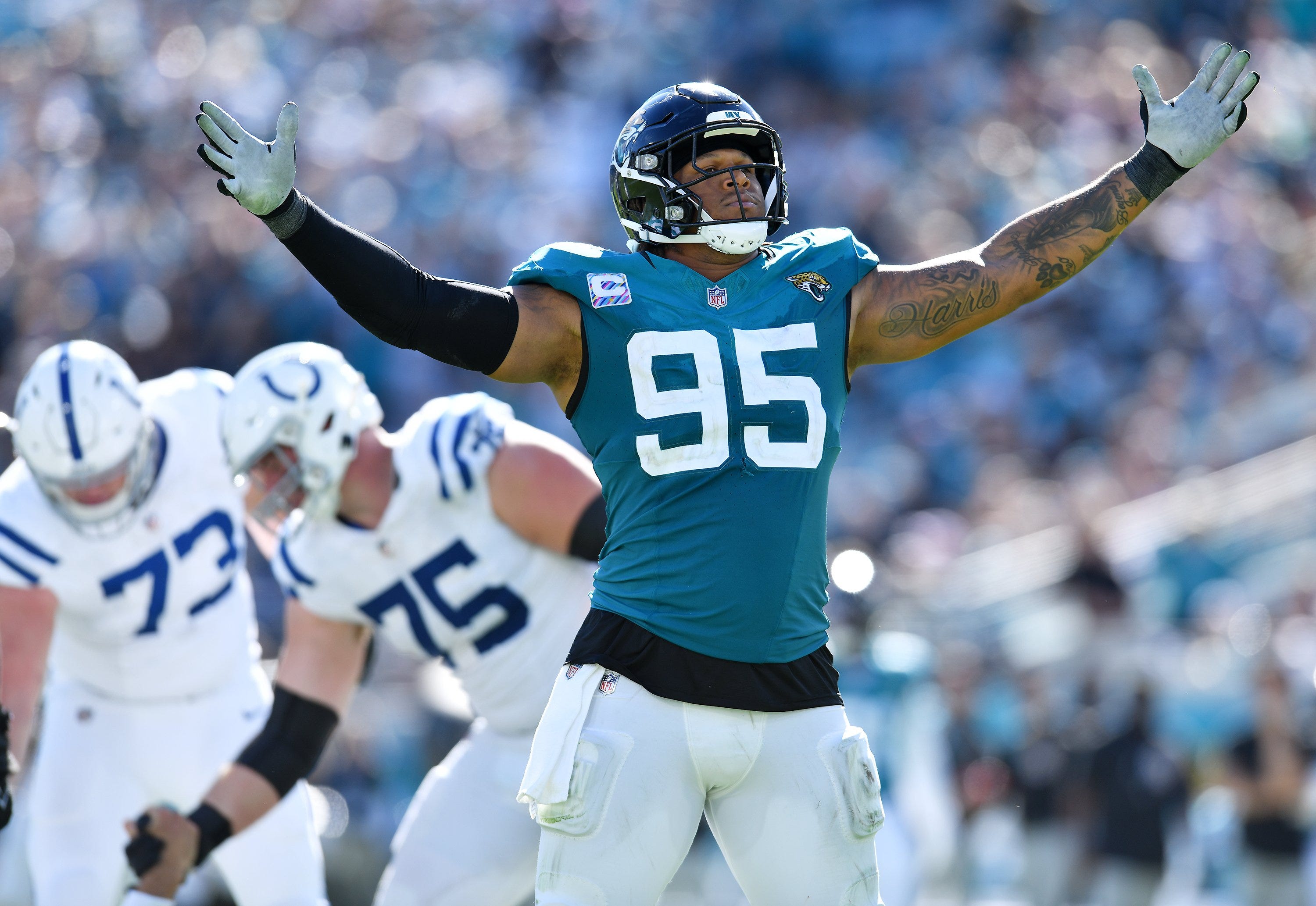 Jacksonville Jaguars defensive end Roy Robertson-Harris (95) celebratres he and linebacker Travon Walker's (44) sack on Indianapolis Colts quarterback Gardner Minshew (10) late in the fourth quarter. The Jacksonville Jaguars hosted the Indianapolis Colts at EverBank Stadium in Jacksonville, FL Sunday, October 15, 2023. The Jaguars ended the first half with a 21 to 6 lead and won with a final score of 37 to 20.