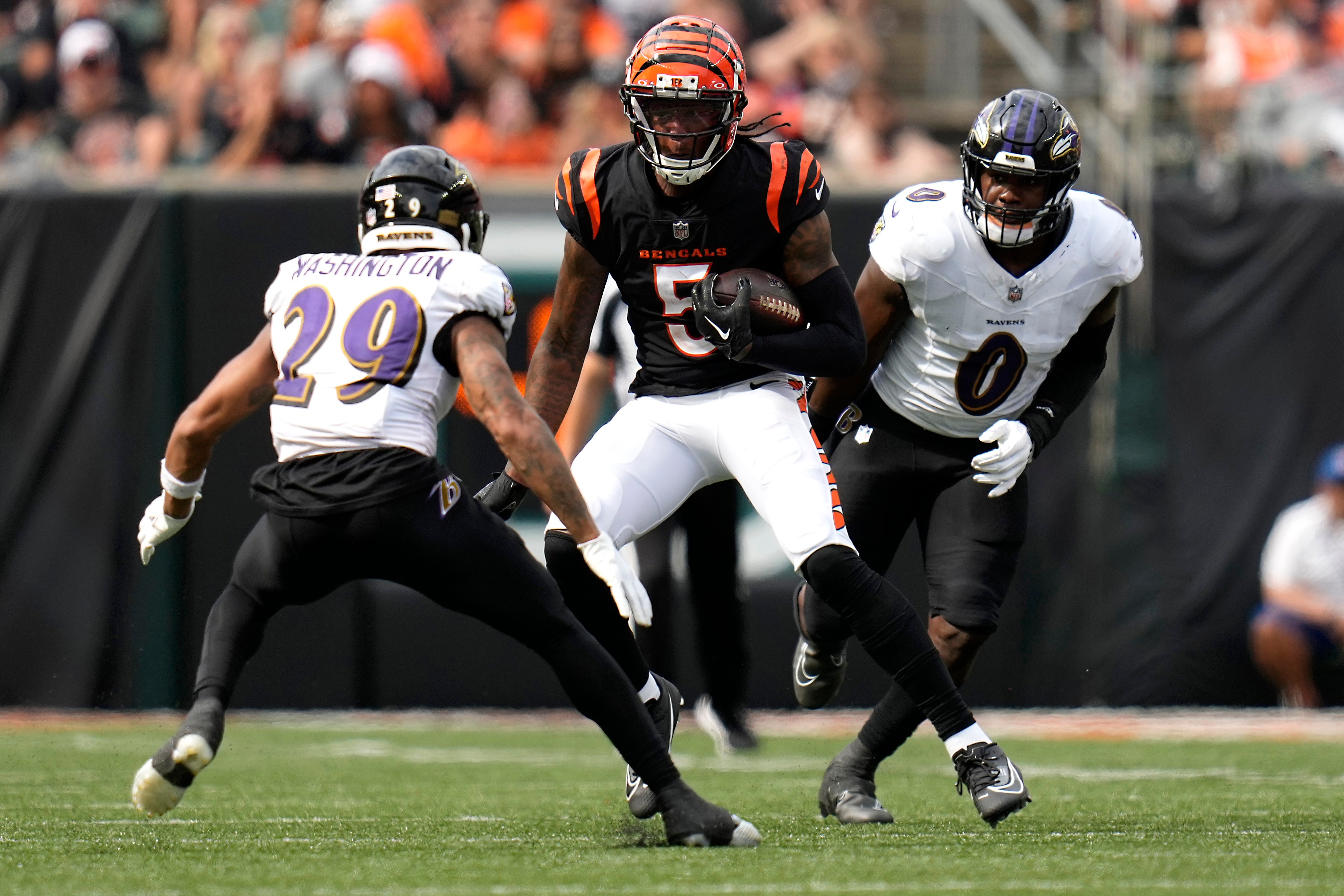 Sep 17, 2023; Cincinnati, Ohio, USA; Cincinnati Bengals wide receiver Tee Higgins (5) runs downfield after completing a catch in the fourth quarter at Paycor Stadium.