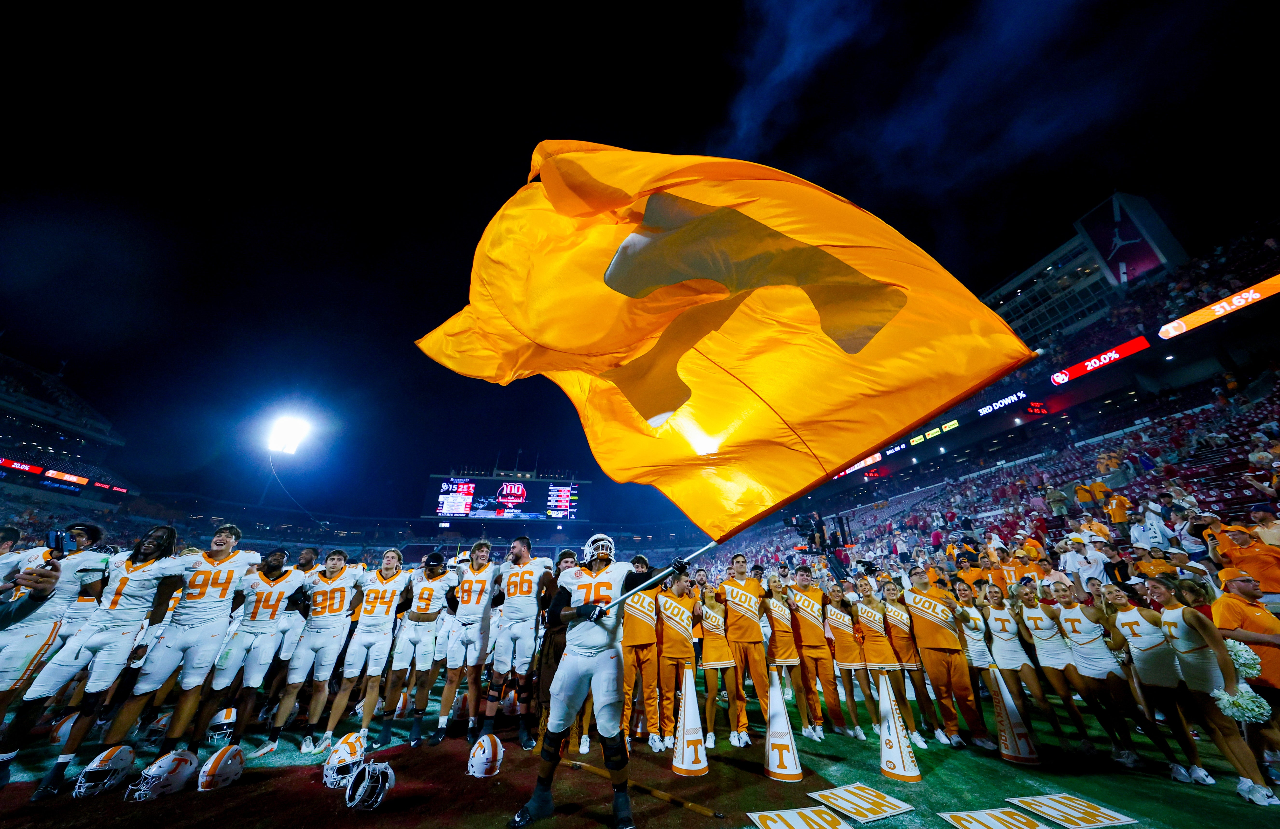 Sep 21, 2024; Norman, Oklahoma, USA; Tennessee Volunteers offensive lineman Javontez Spraggins (76) waves a Tennessee Volunteers flag after the game against the Oklahoma Sooners at Gaylord Family-Oklahoma Memorial Stadium.